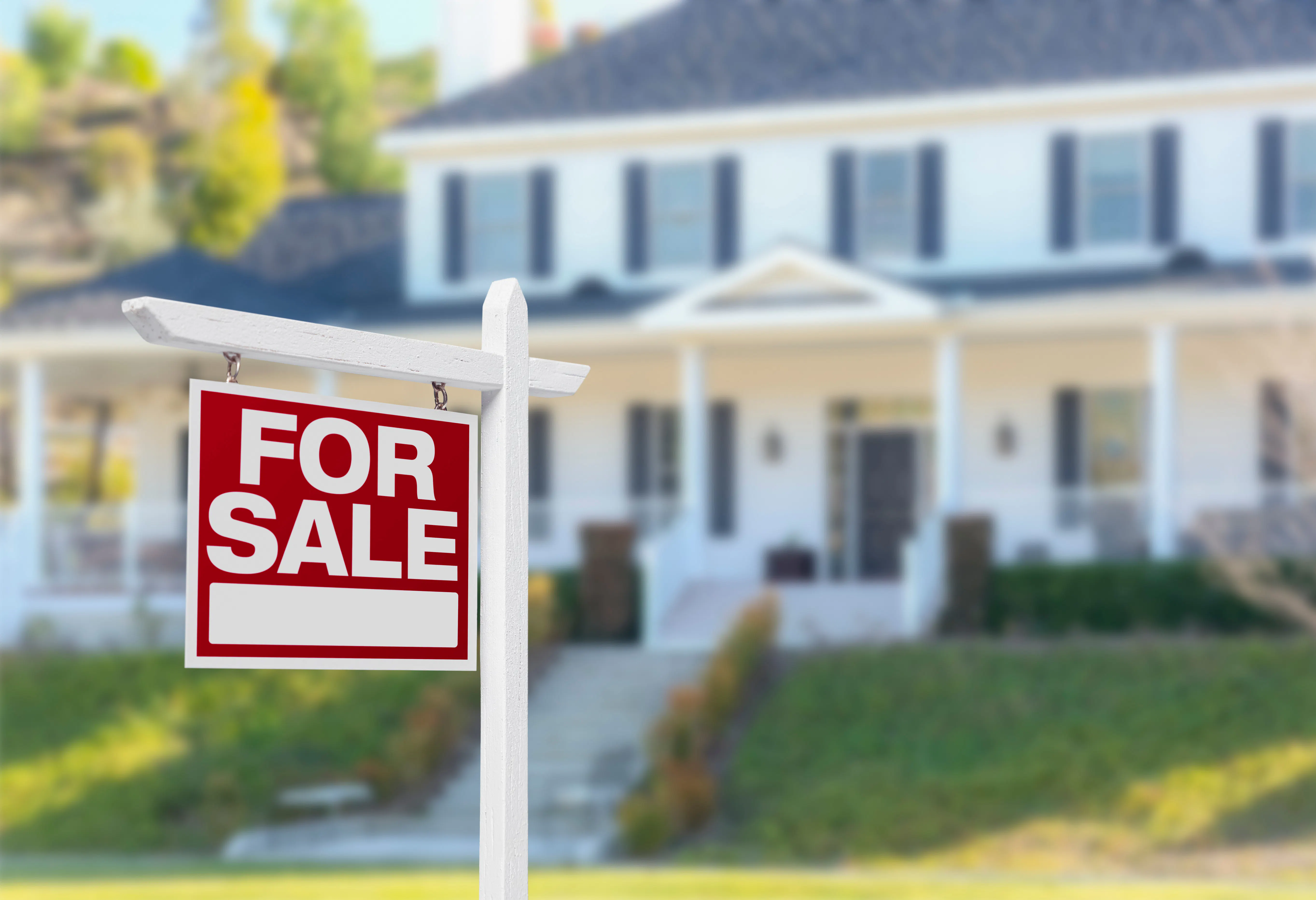 Home For Sale Sign in Front of New House