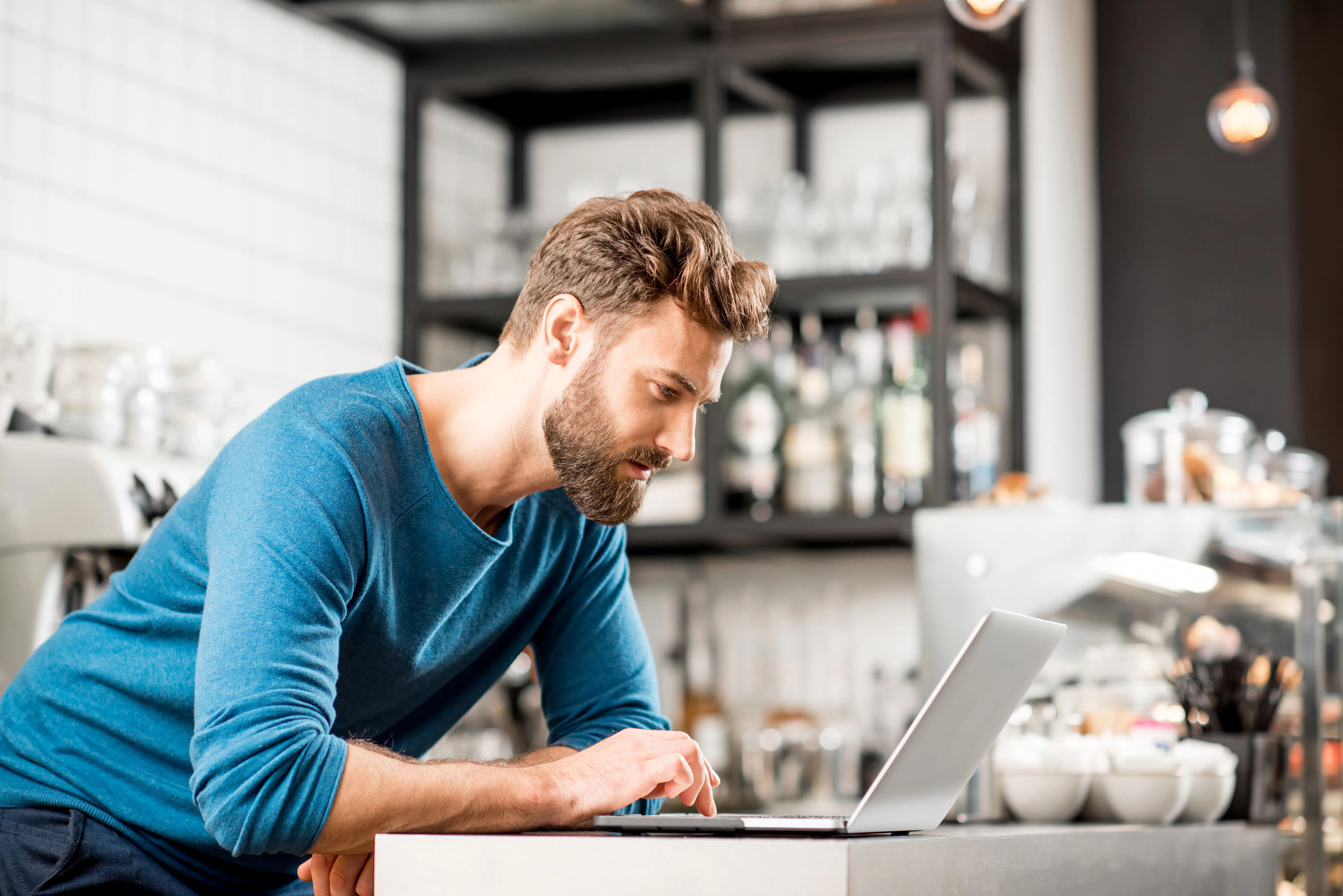 Business owner working on his laptop