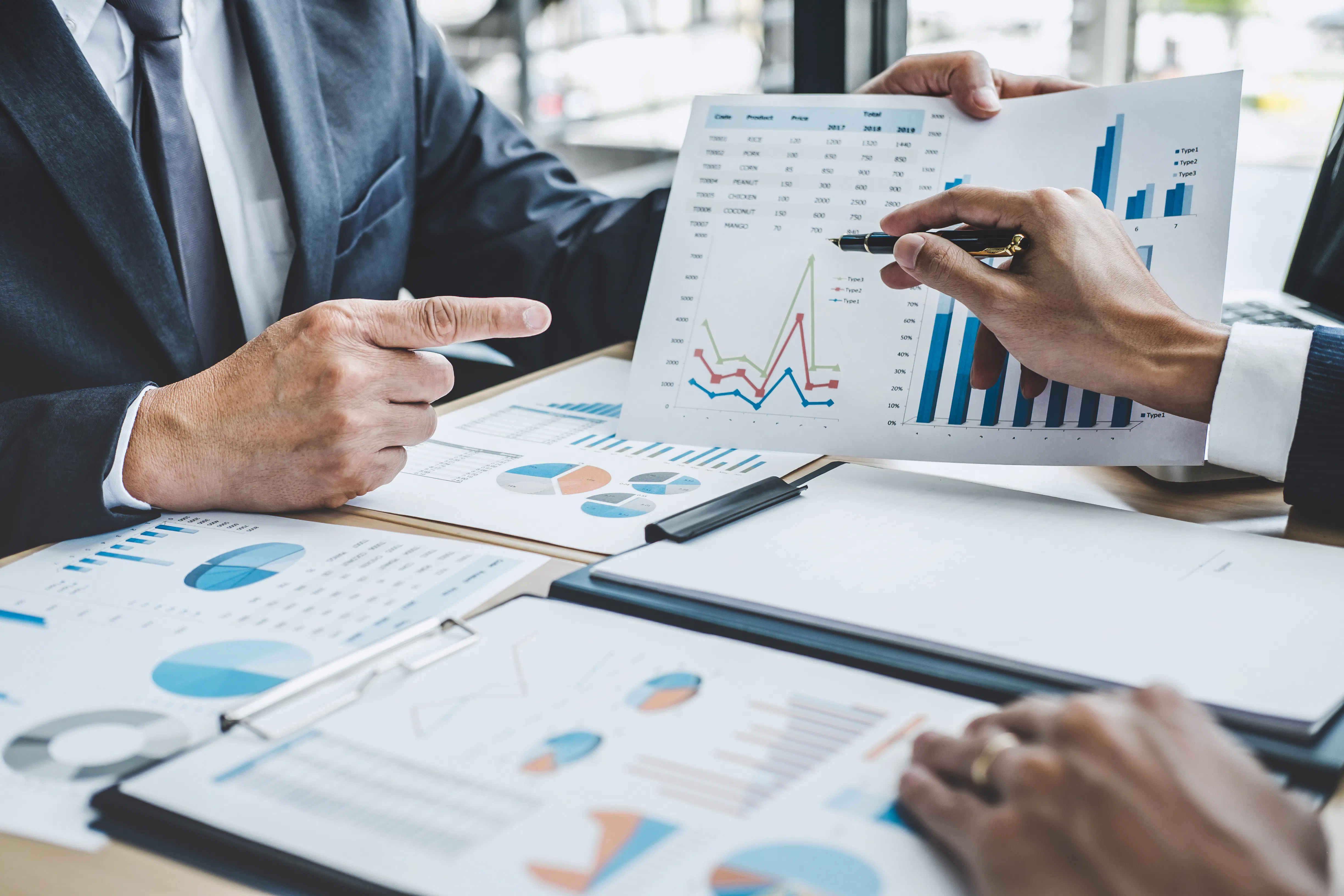 Two executive discussing company growth project success financial statistics, Partner meeting professional investor working start up project for both company with document