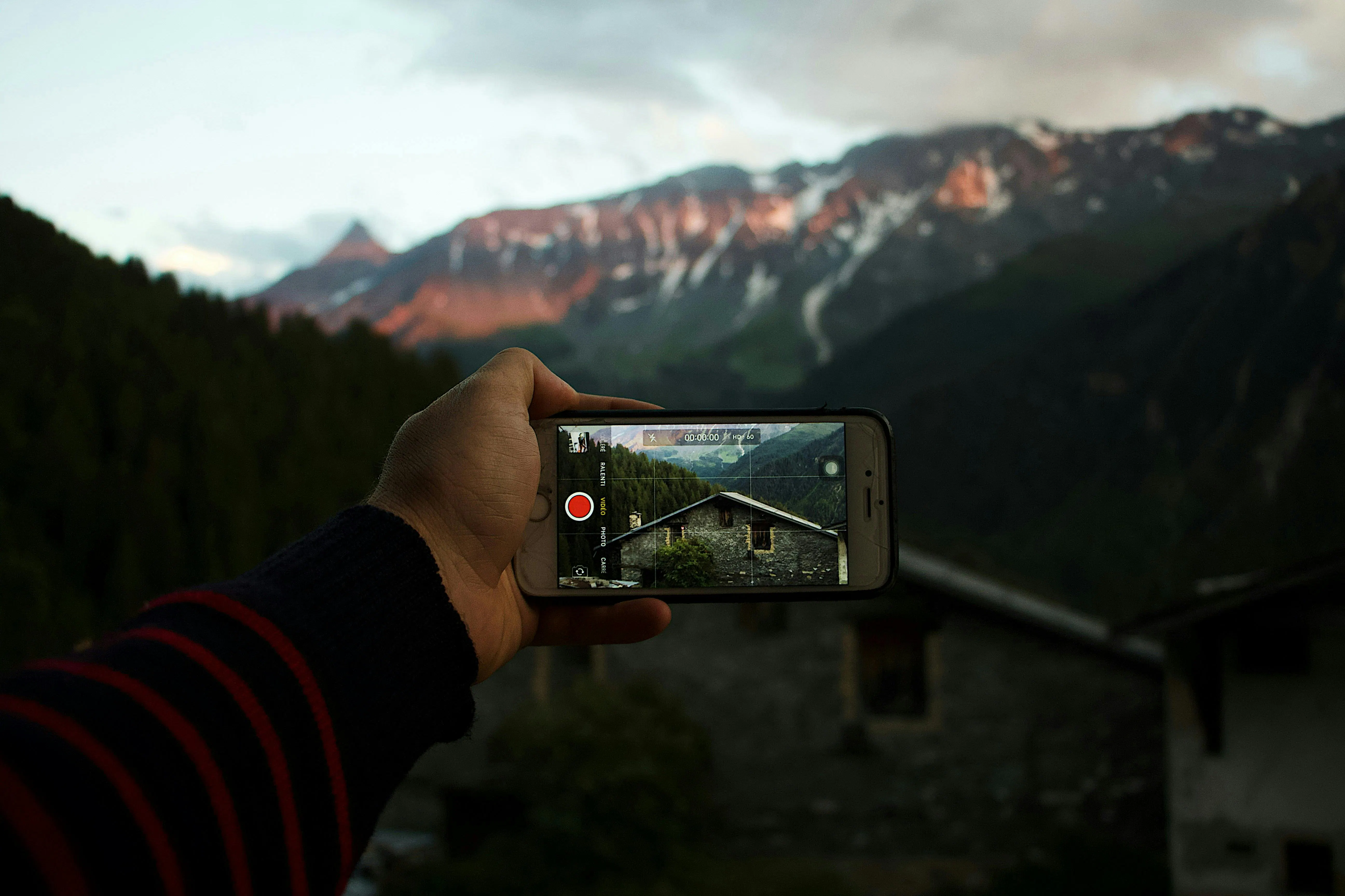 Man taking video of rental exterior