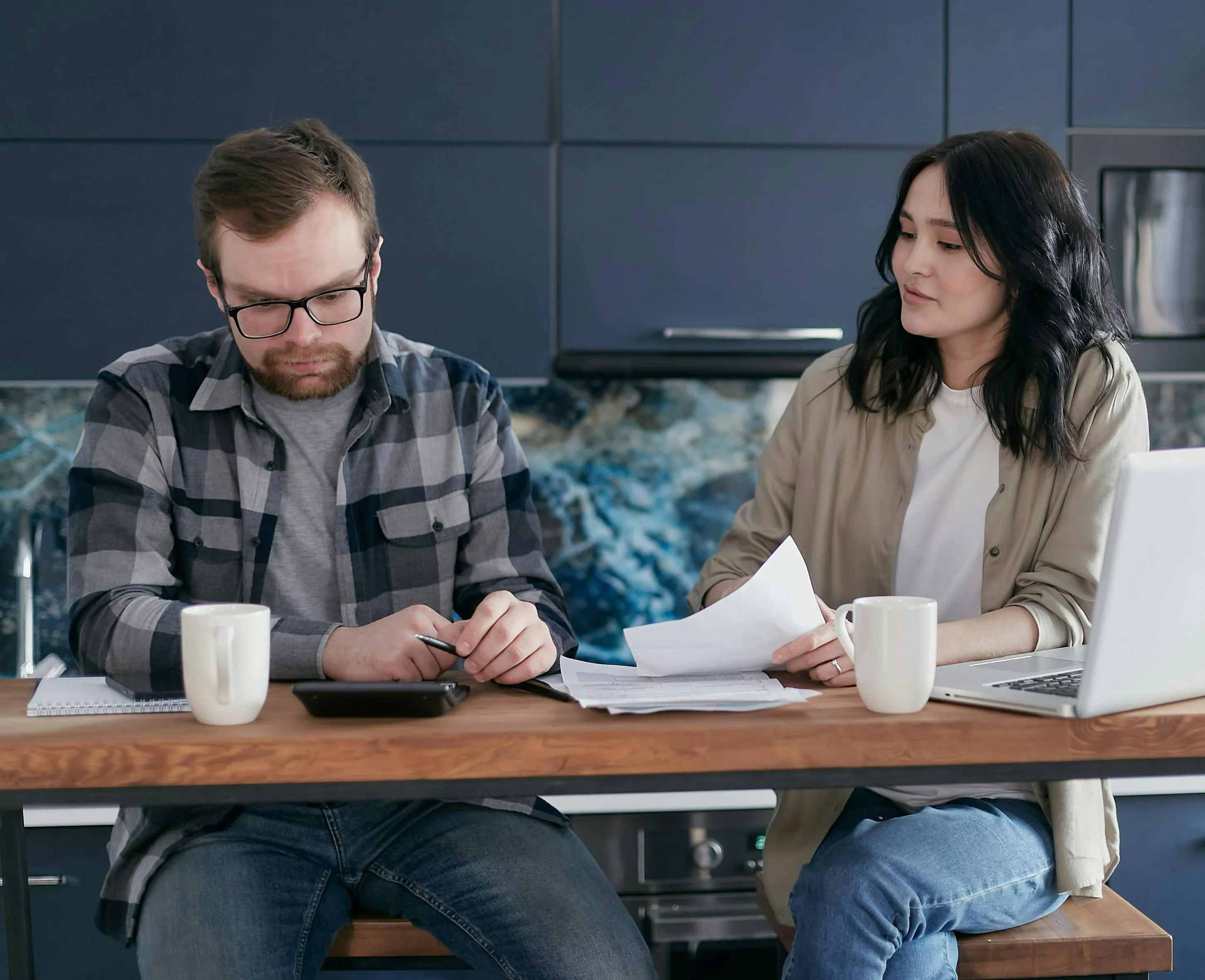 Property owners calculating vacation rental revenue.