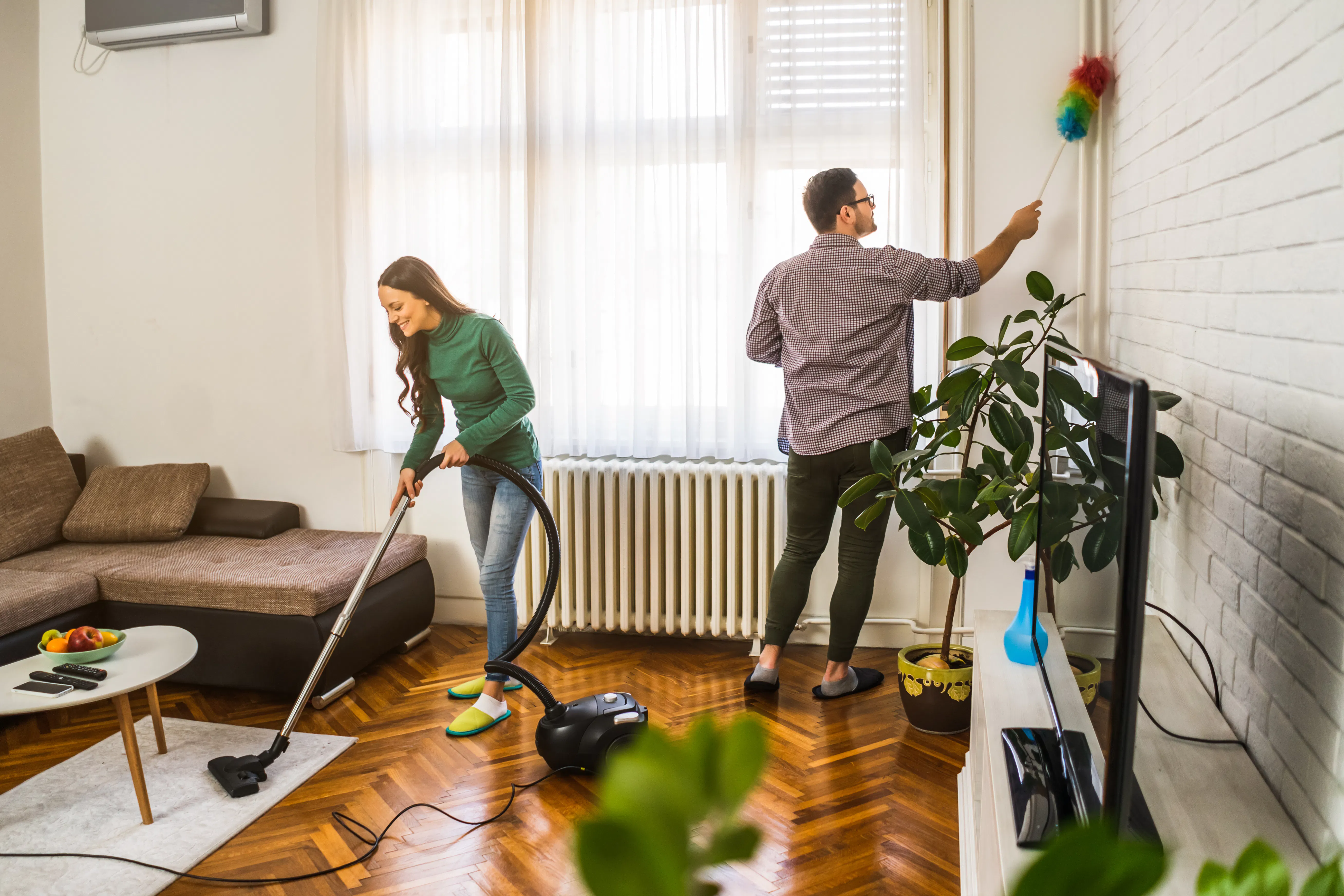 Couple cleaning Airbnb