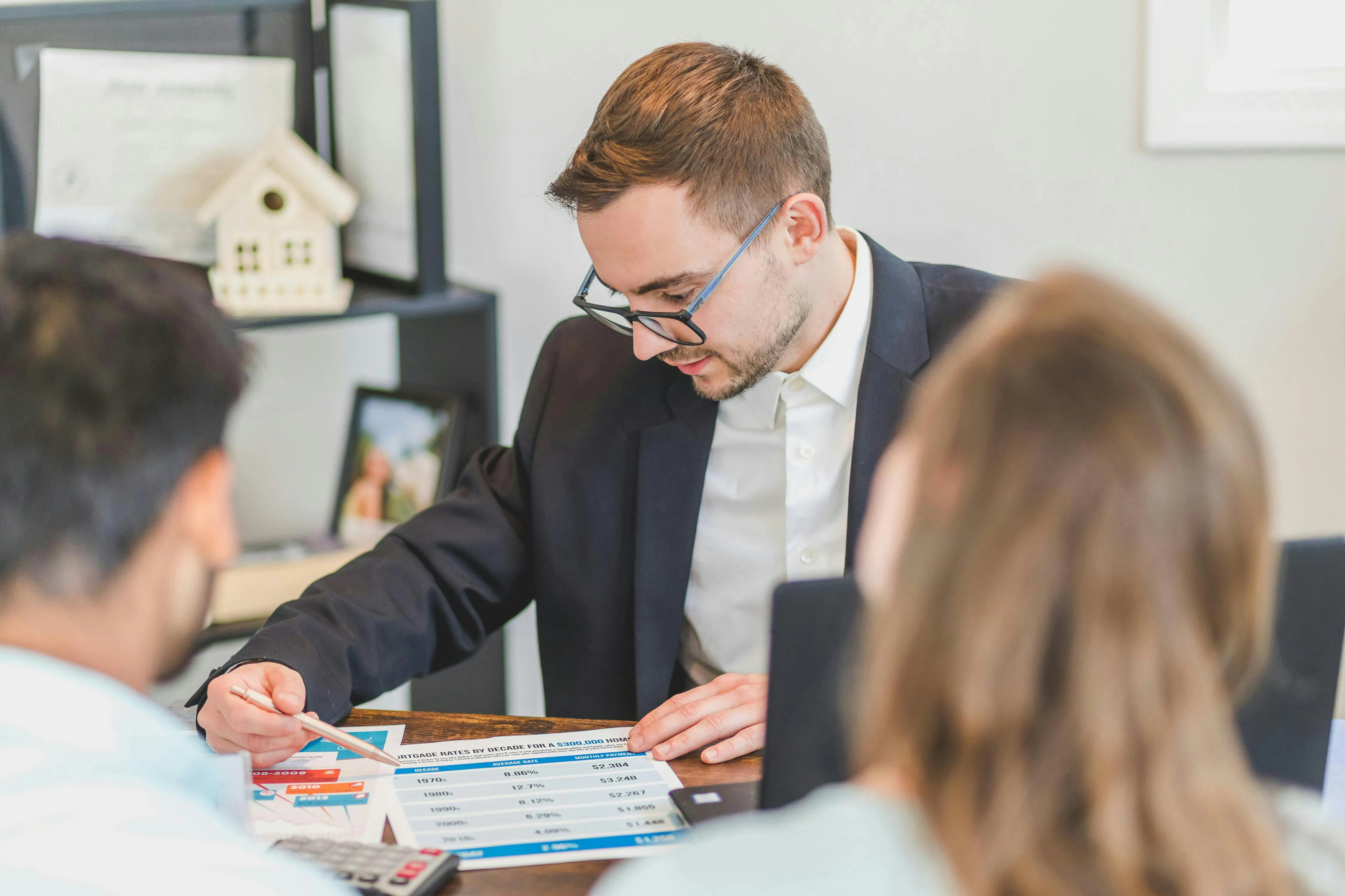 Real estate agent reviewing numbers with client