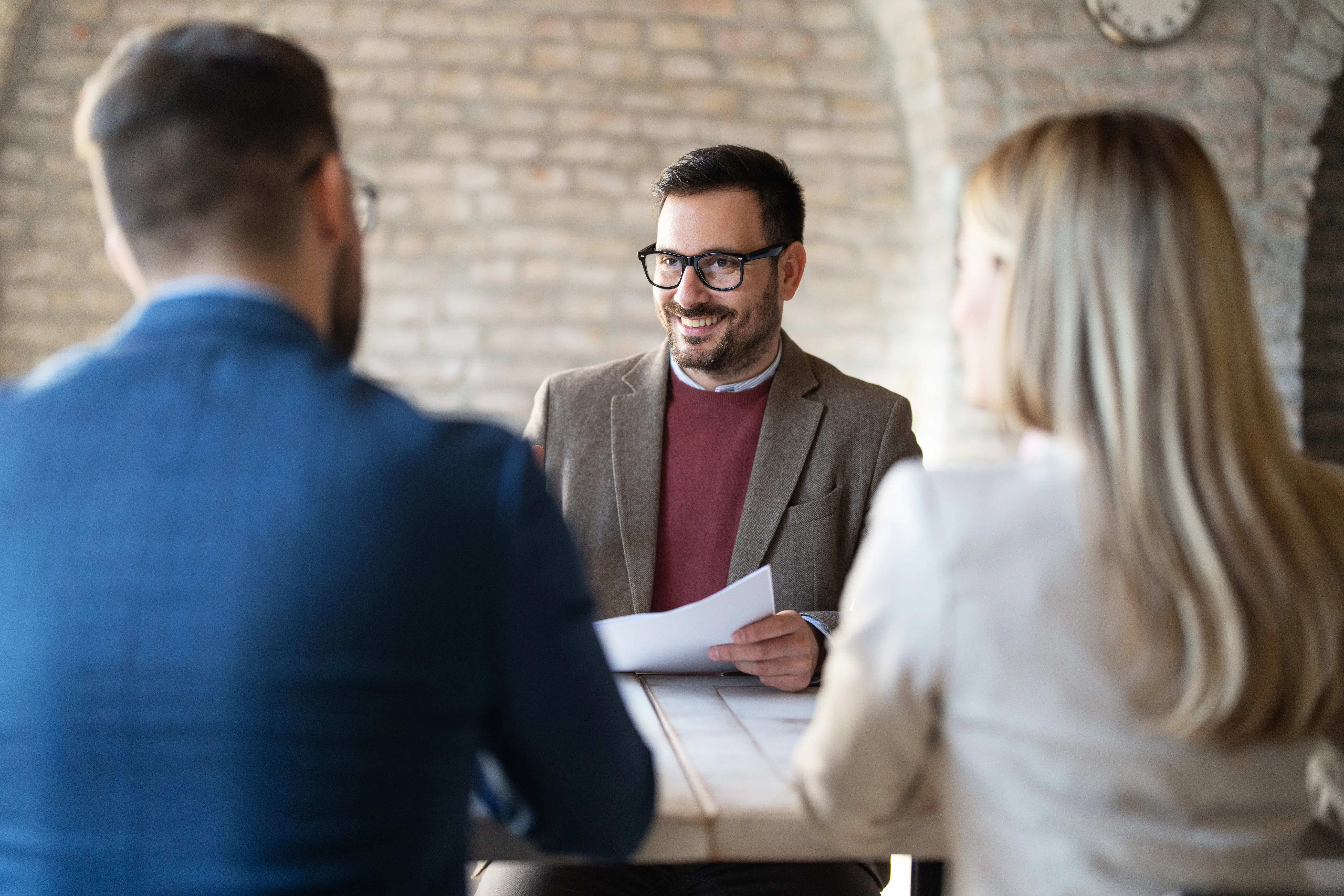 Property manager talking to couple