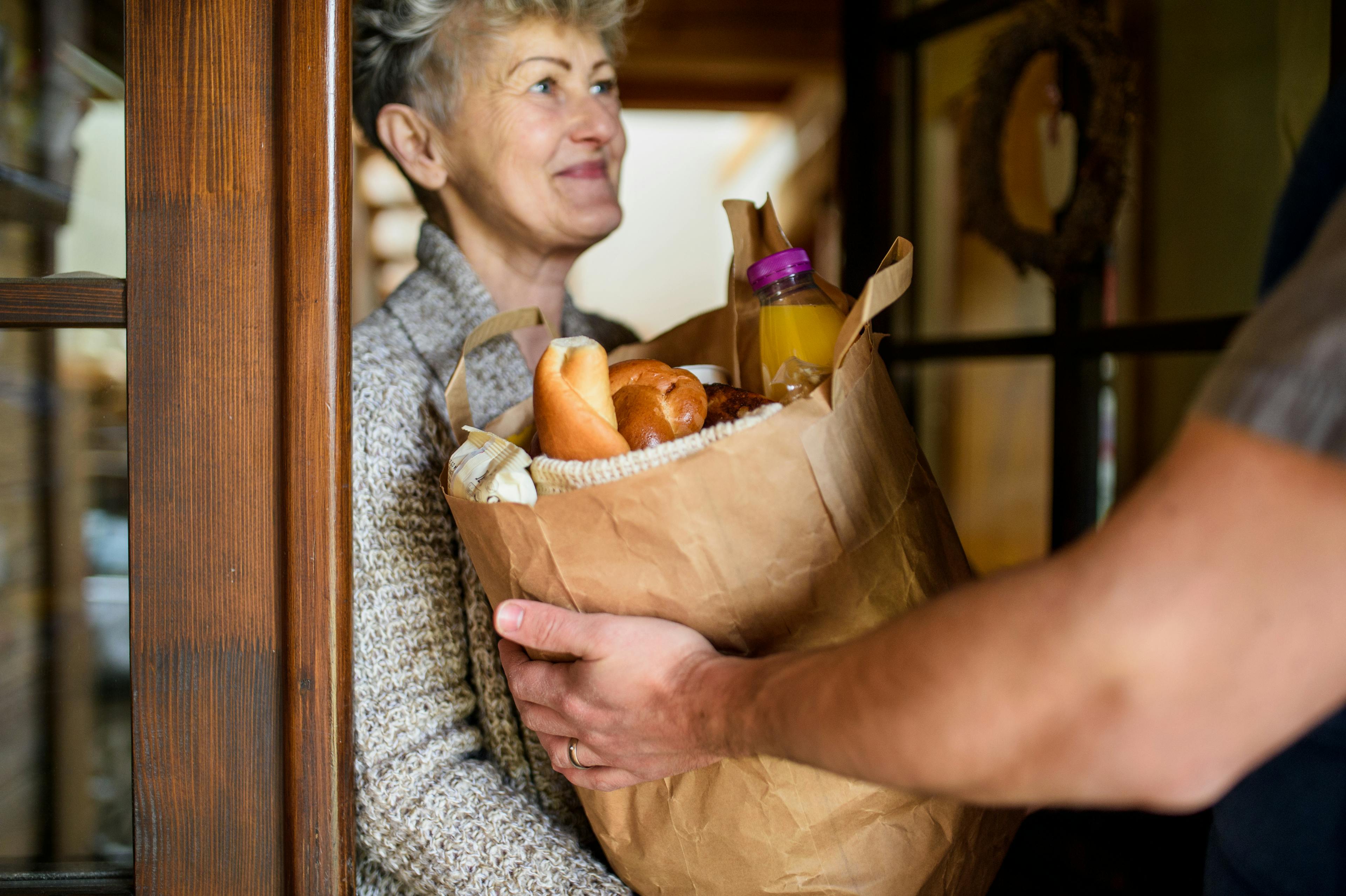 Groceries being delivered to woman