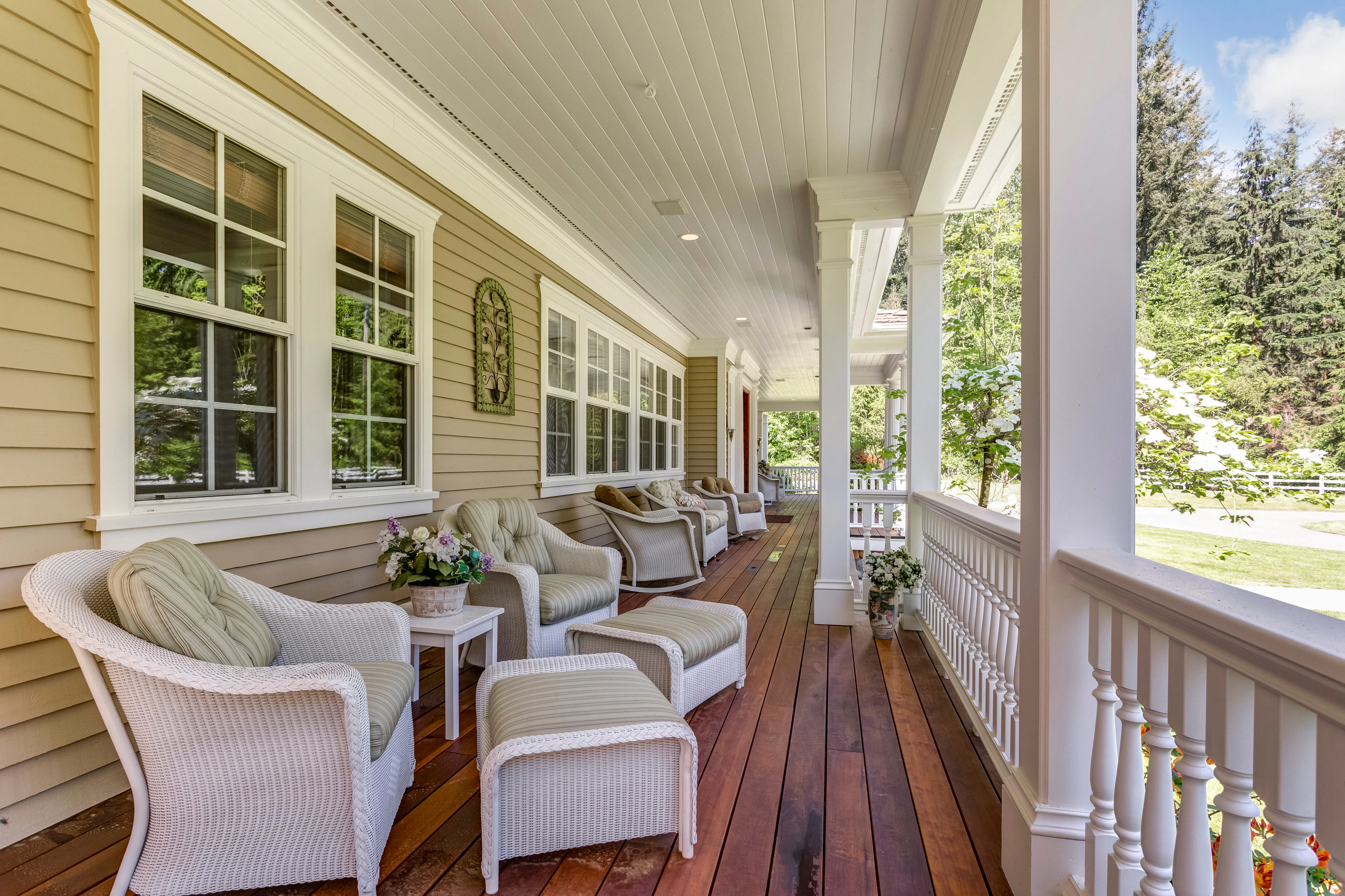 Large country home with wrap-around deck