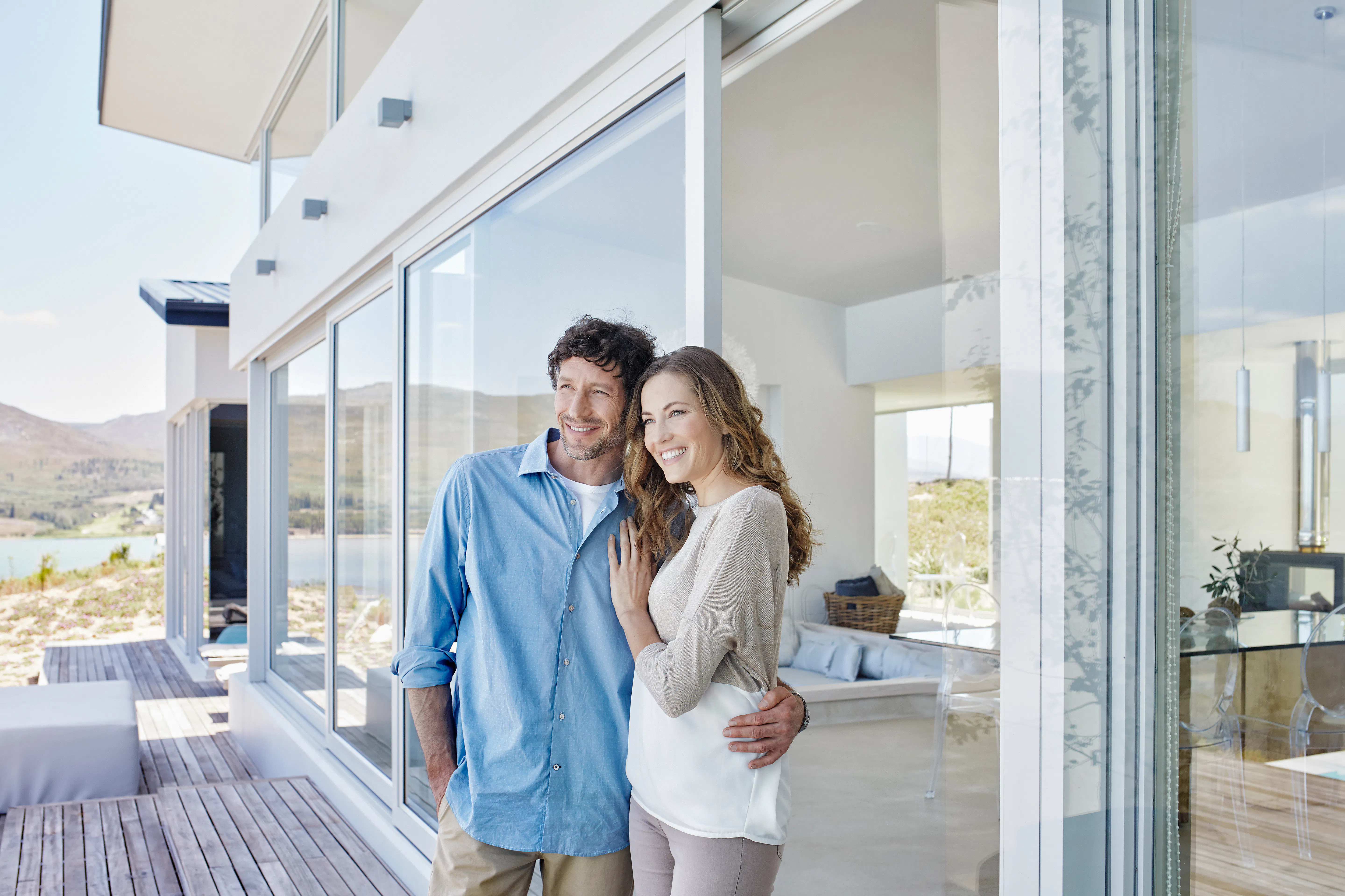 Happy couple standing in doorway