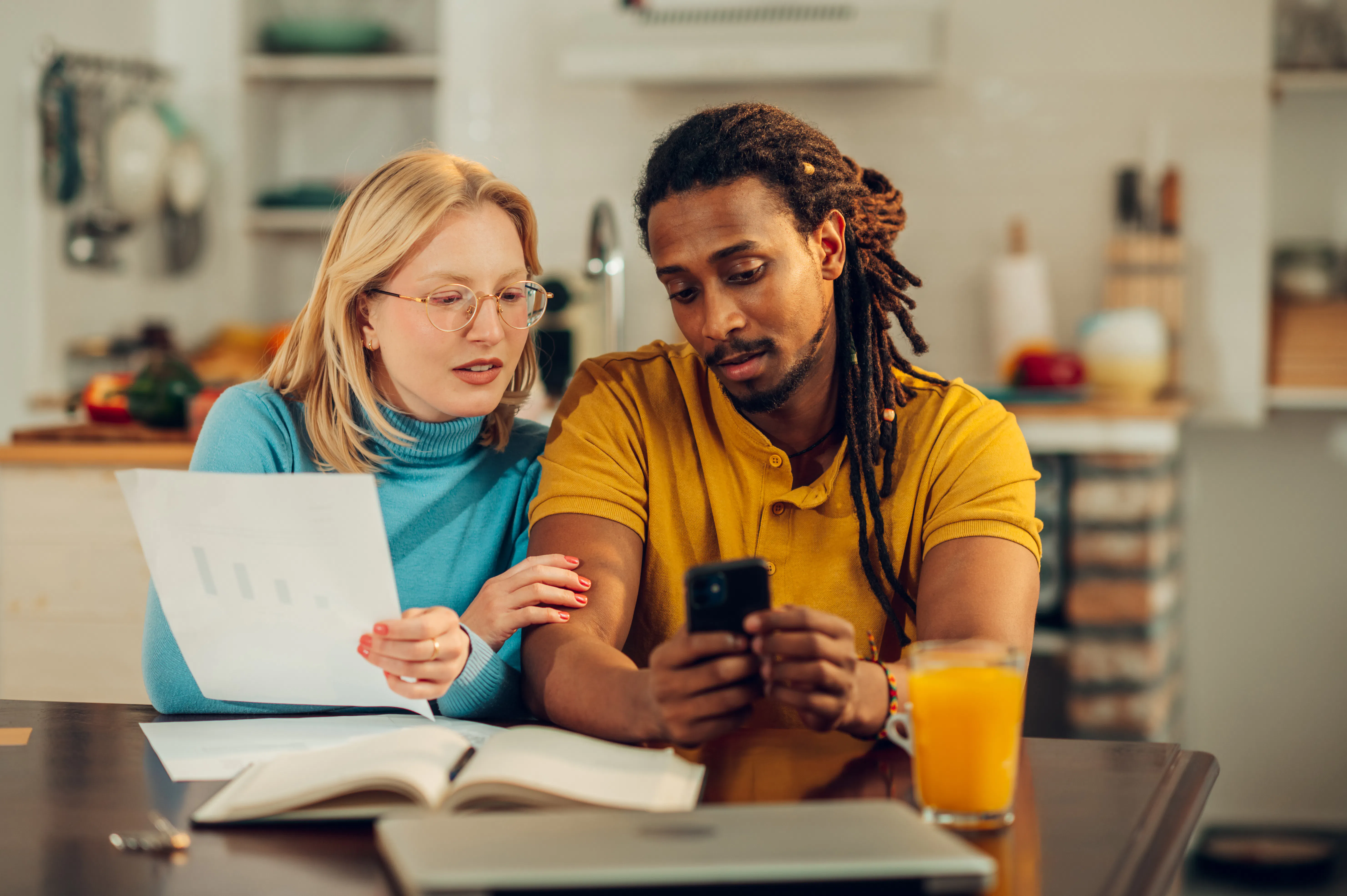 Couple doing paperwork at home