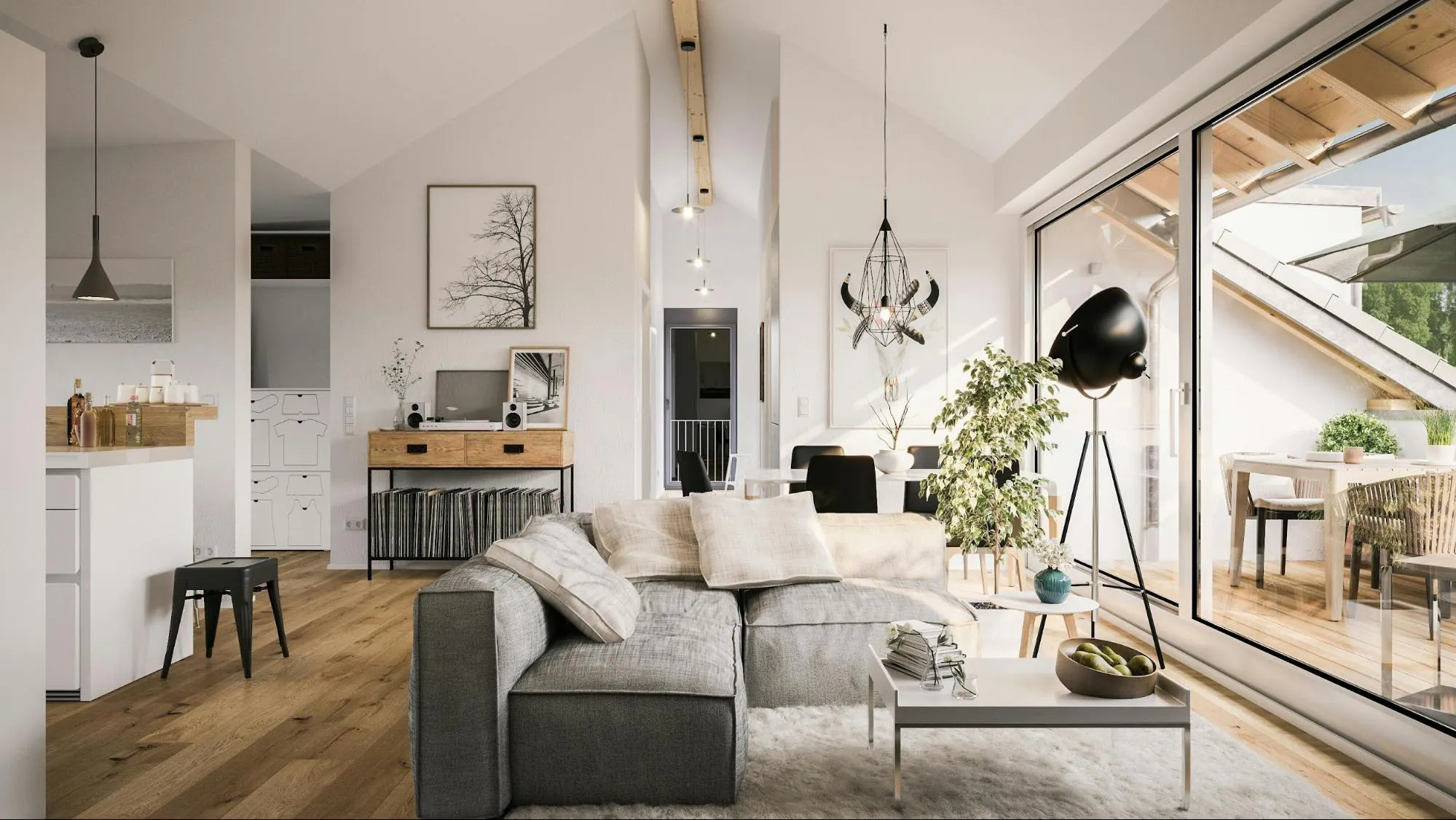 Bright, modern, open-plan living room with vaulted ceilings, a gray sectional sofa, and a large sliding glass door to a deck.