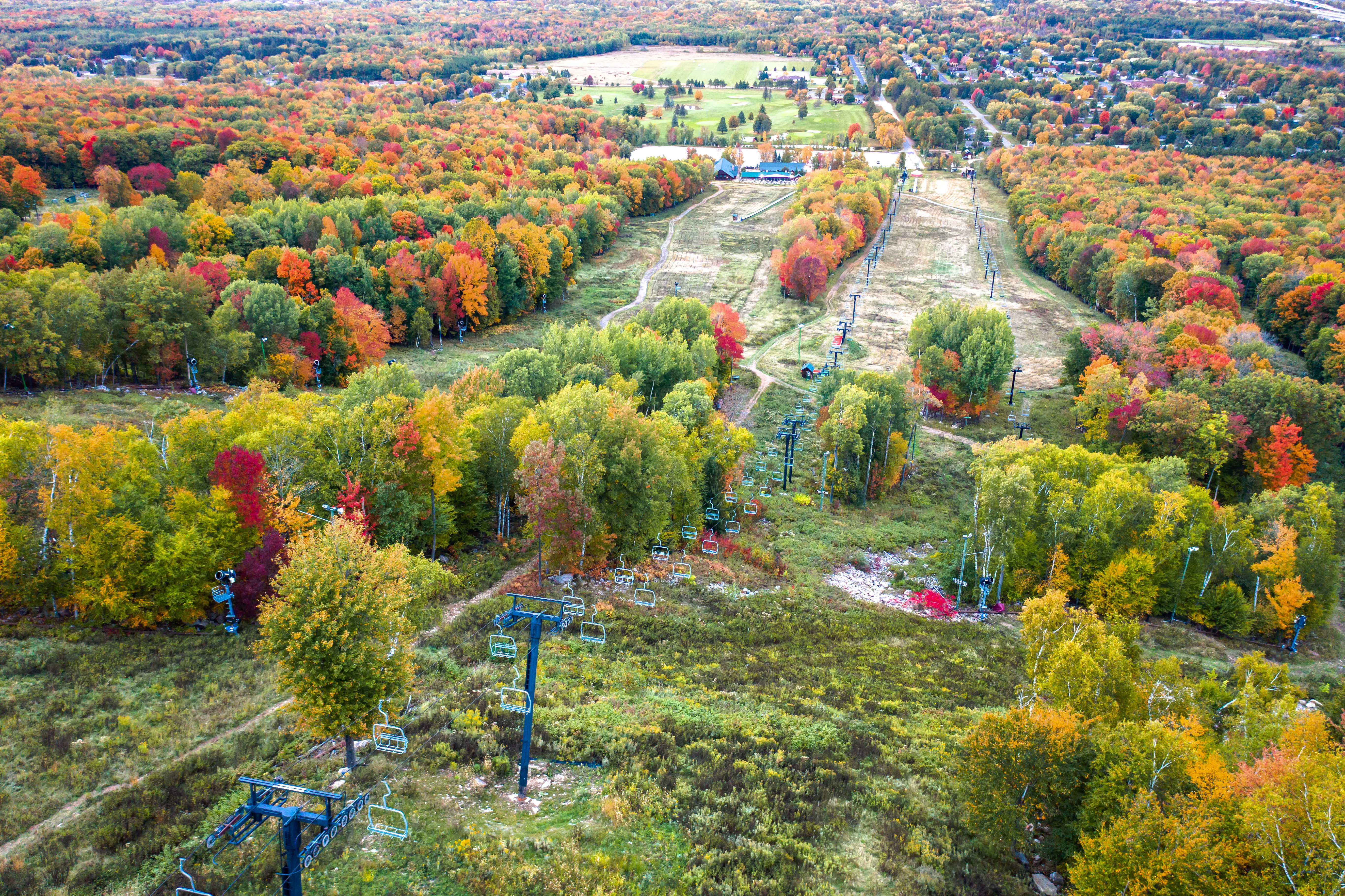Beautiful aerial view looking down one of the ski runs at Rib Mountain in the autumn season