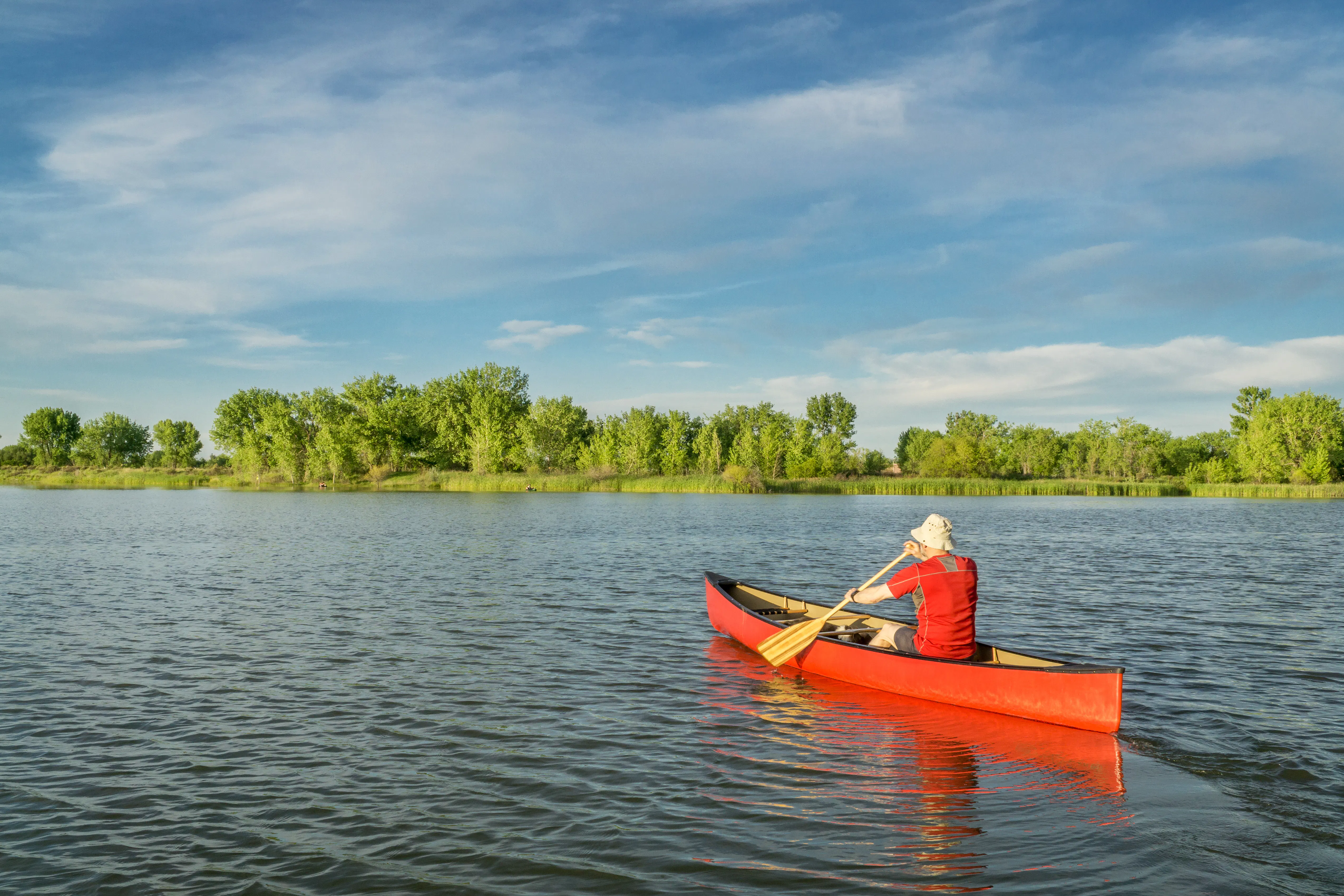 Man canoeing on lake