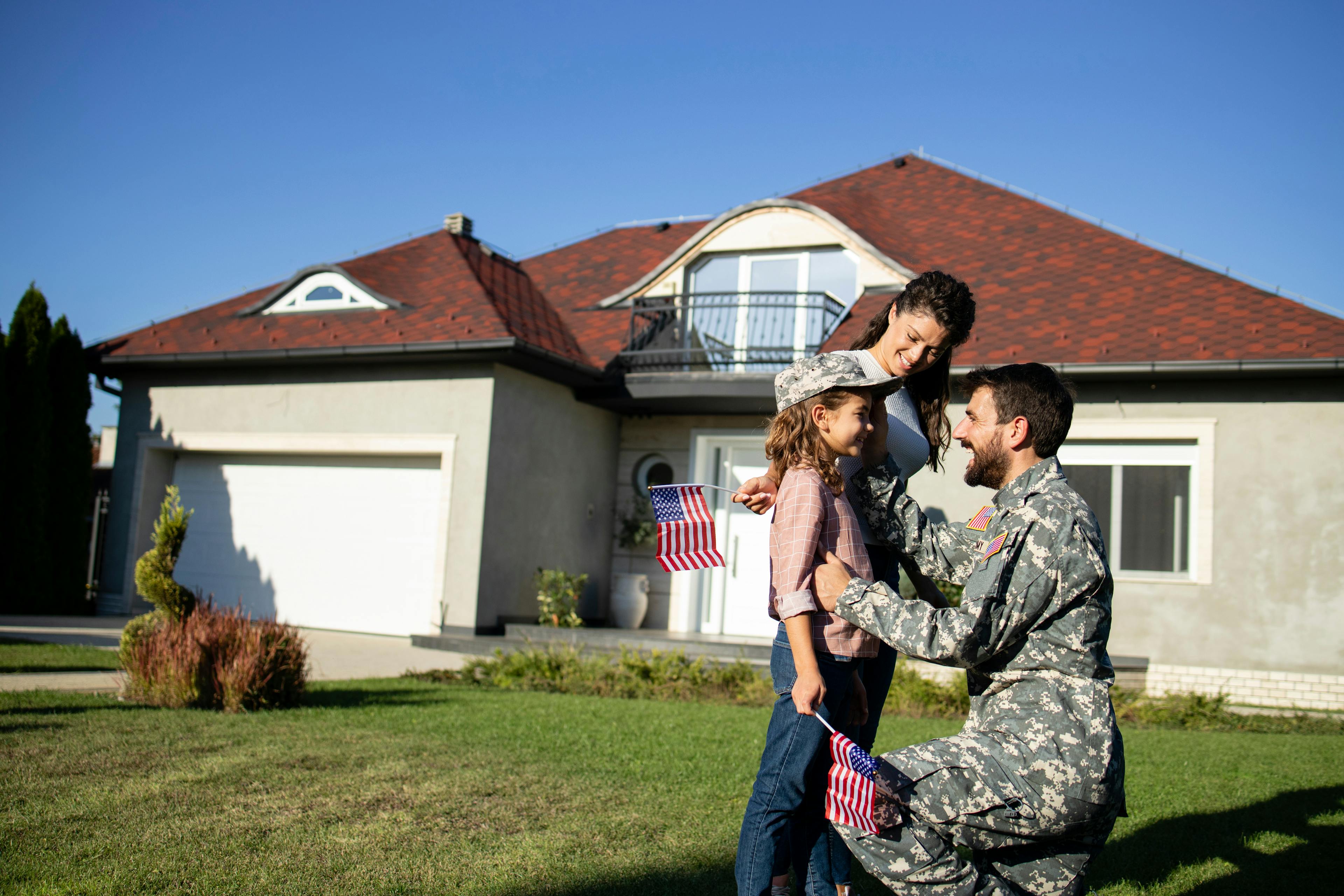 Soldier in military uniform talking to his daughter and wife after long time.
