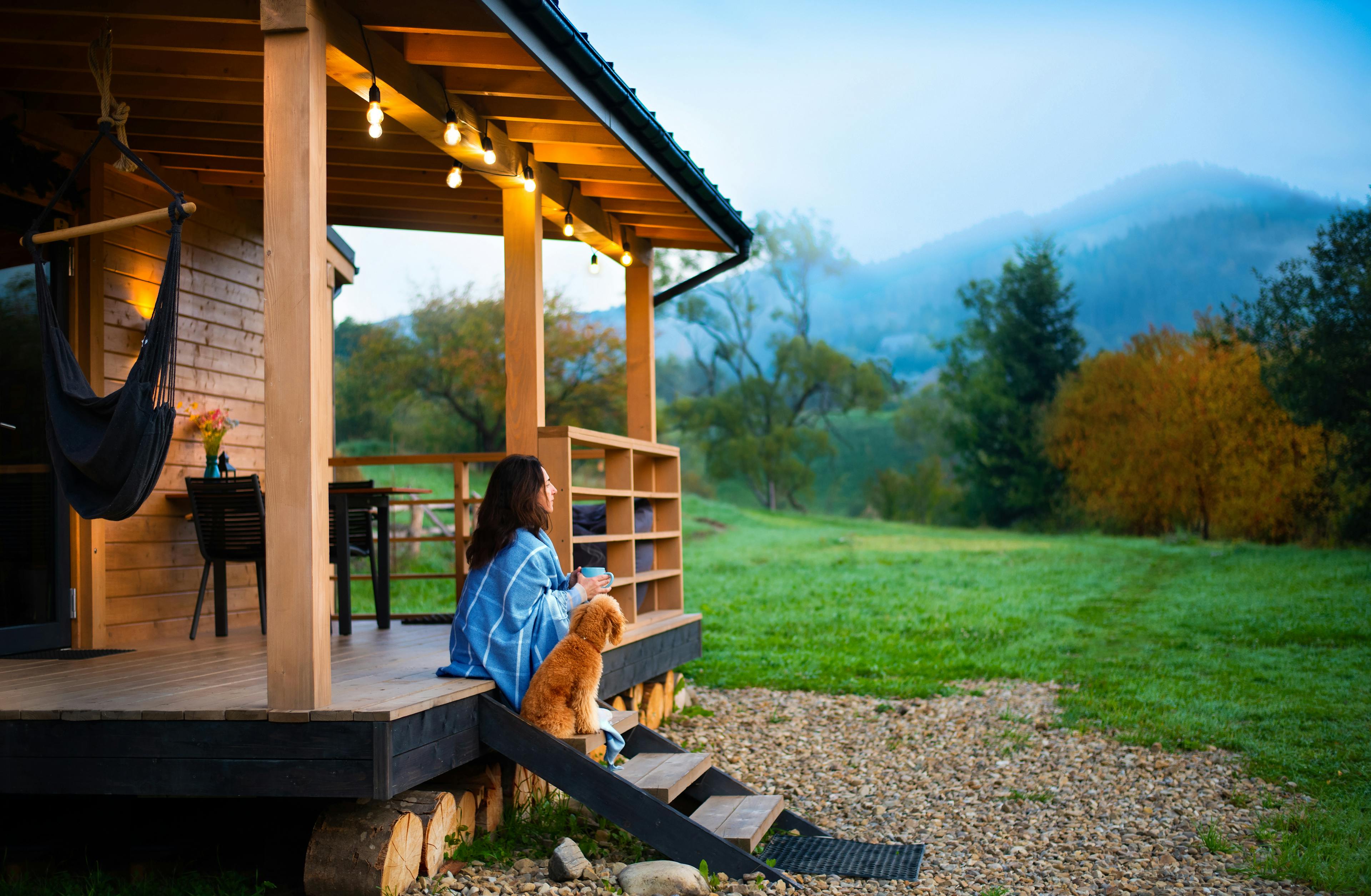 Woman sitting on steps of vacation rental