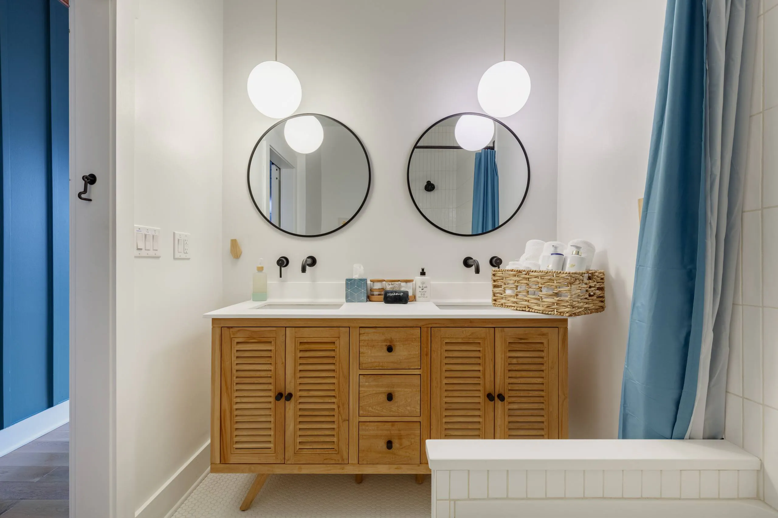Bathroom inside Treeside Retreat, the mid-century modern home my husband and I bought as our first short-term rental.