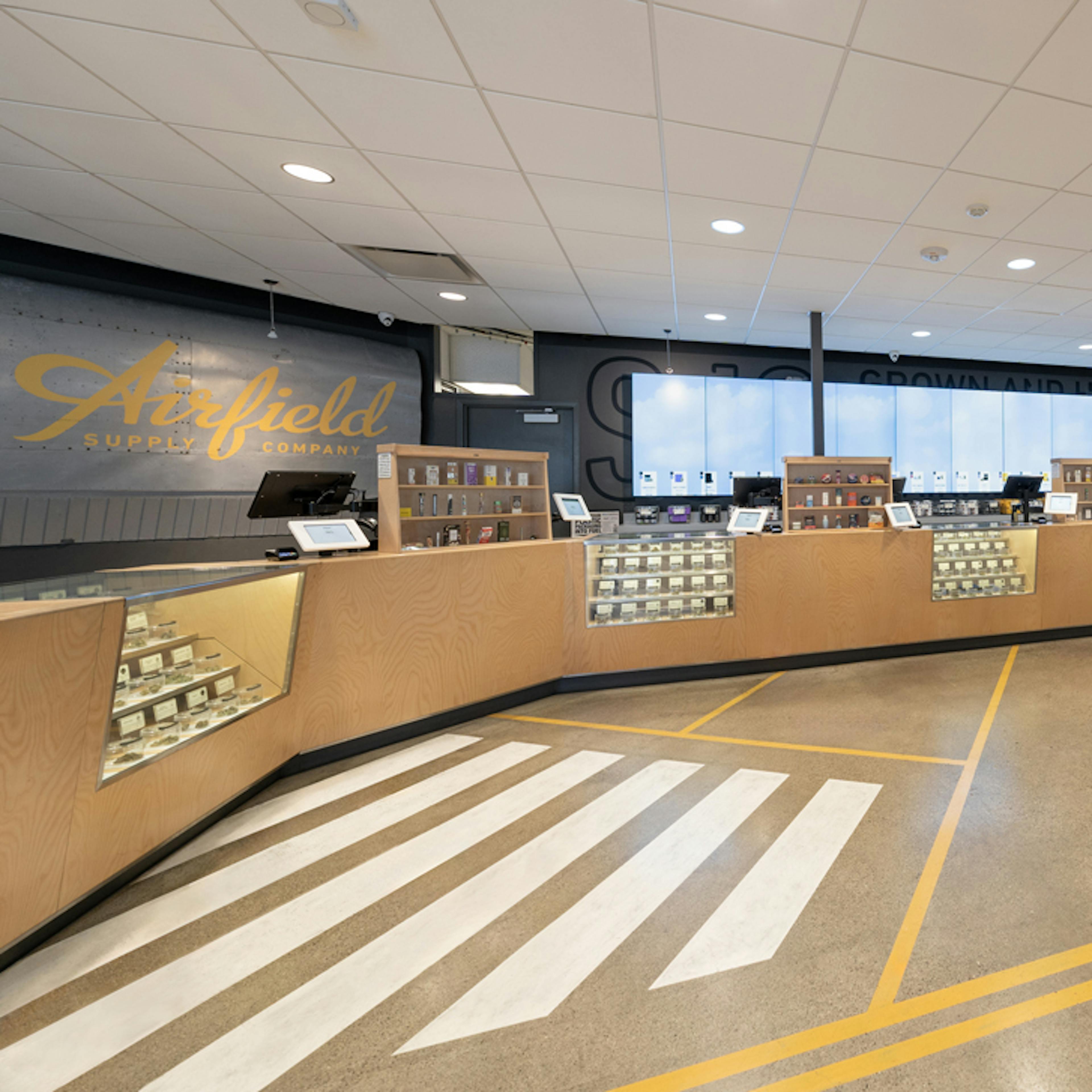 In-store view of Airfield cannabis display counters