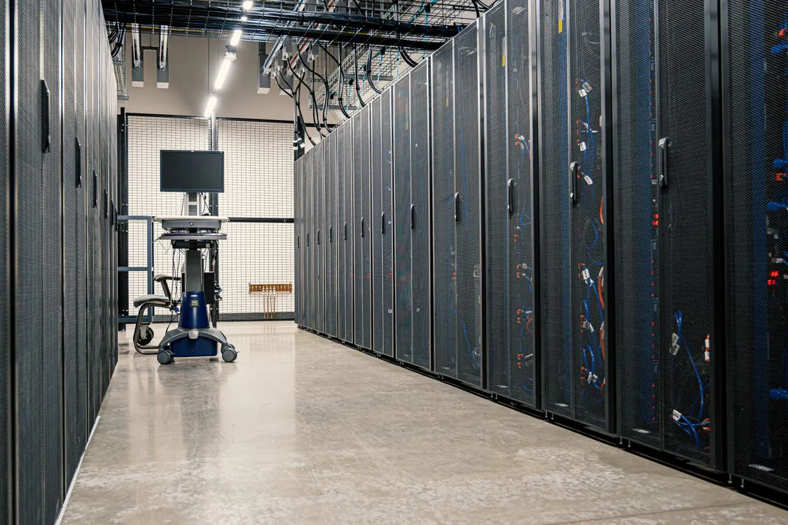 Modern data center corridor with server racks representing government IT infrastructure and audit-ready document pipelines