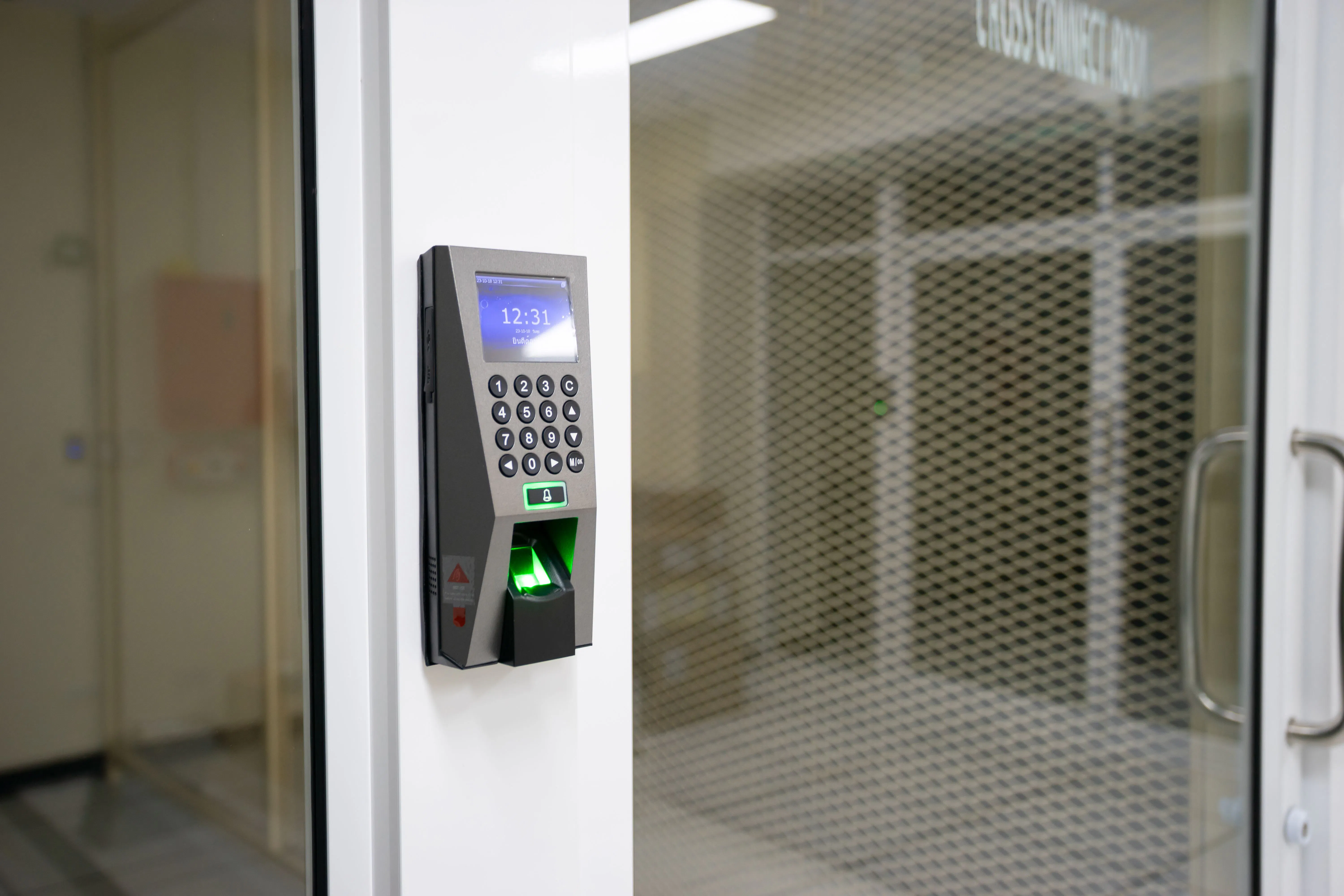 Modern fingerprint access control scanner used for secure authentication, illustrating multifactor authentication for government systems.