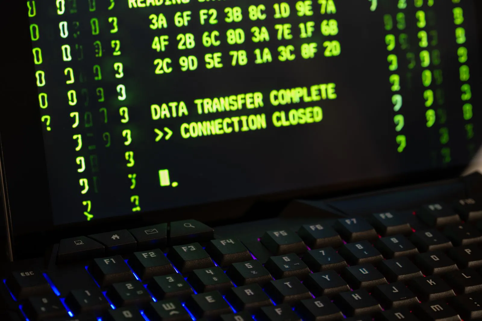Computer monitor displaying a completed data transfer message, representing a government system migration.