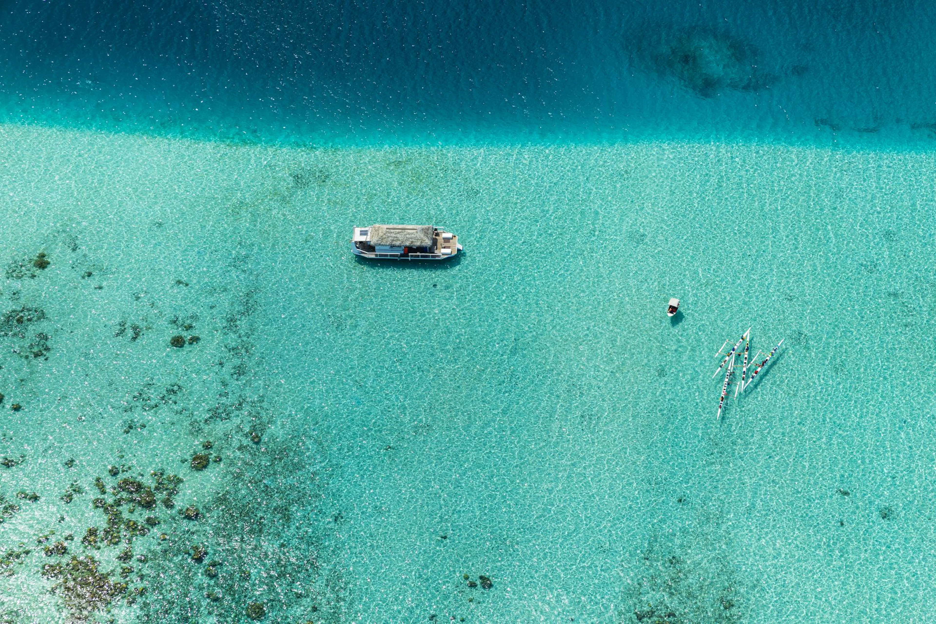 Boat in tahitian's lagoon