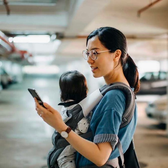Woman with phone and child