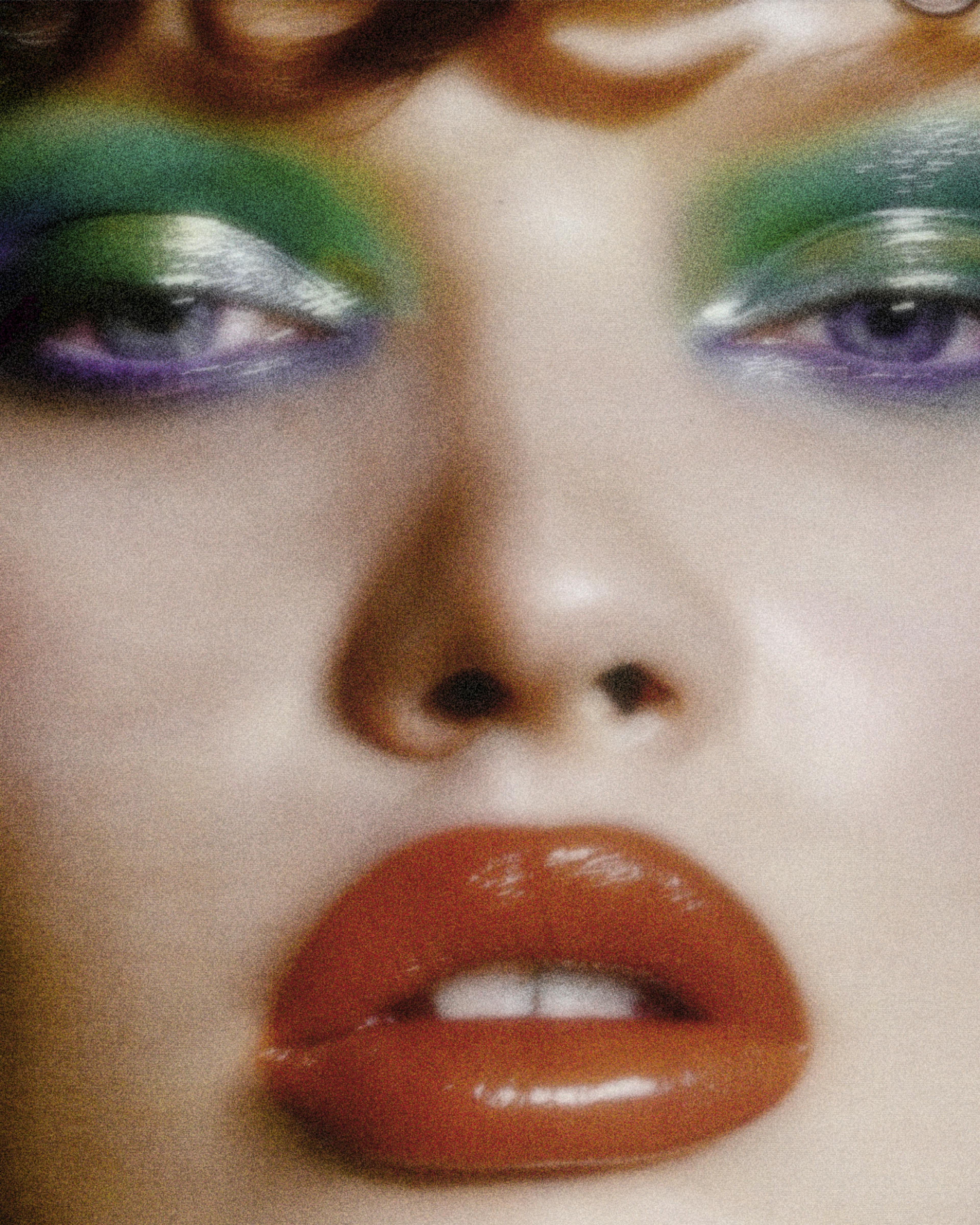 Close up of a woman wearing colorful makeup