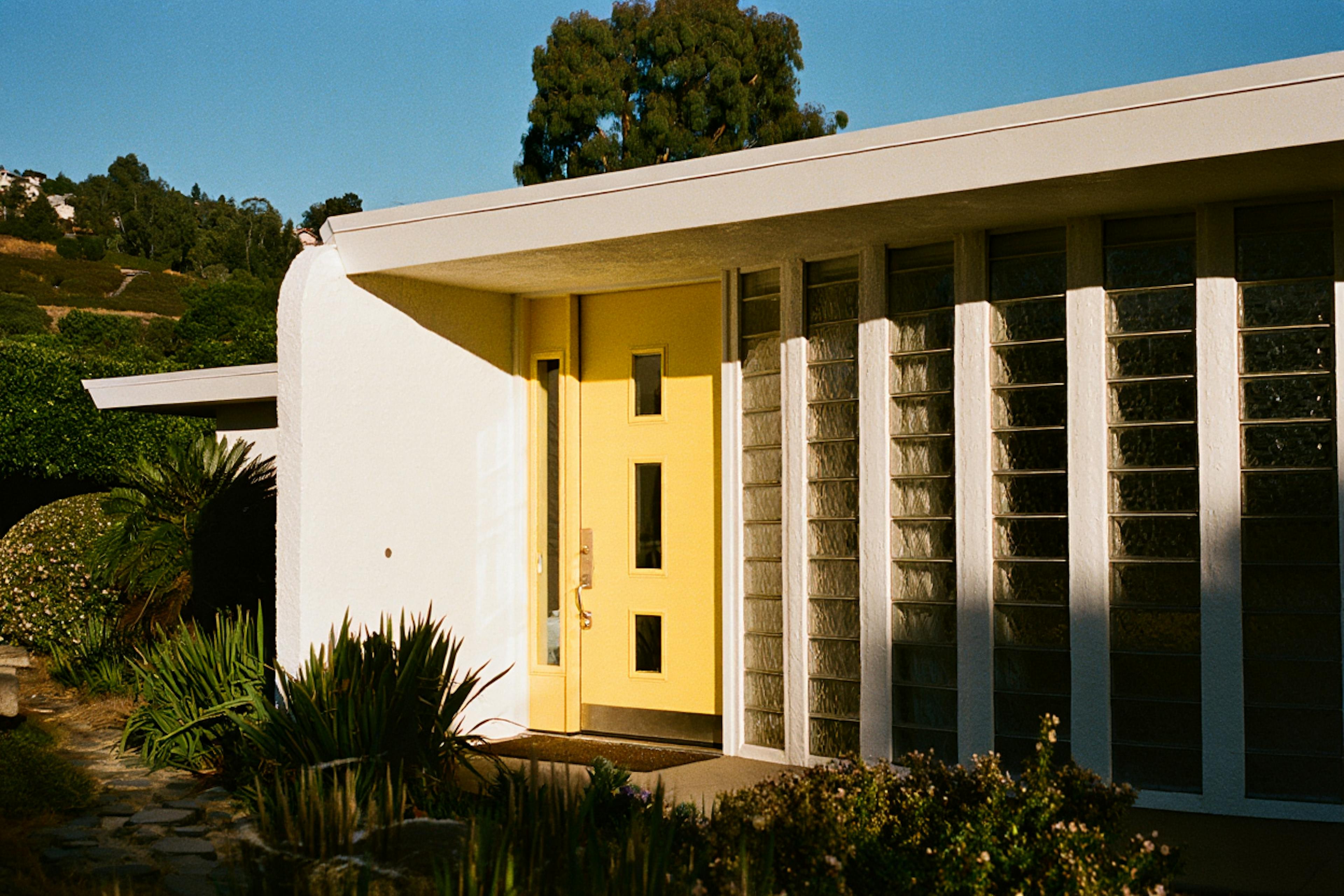 house with yellow flashy door