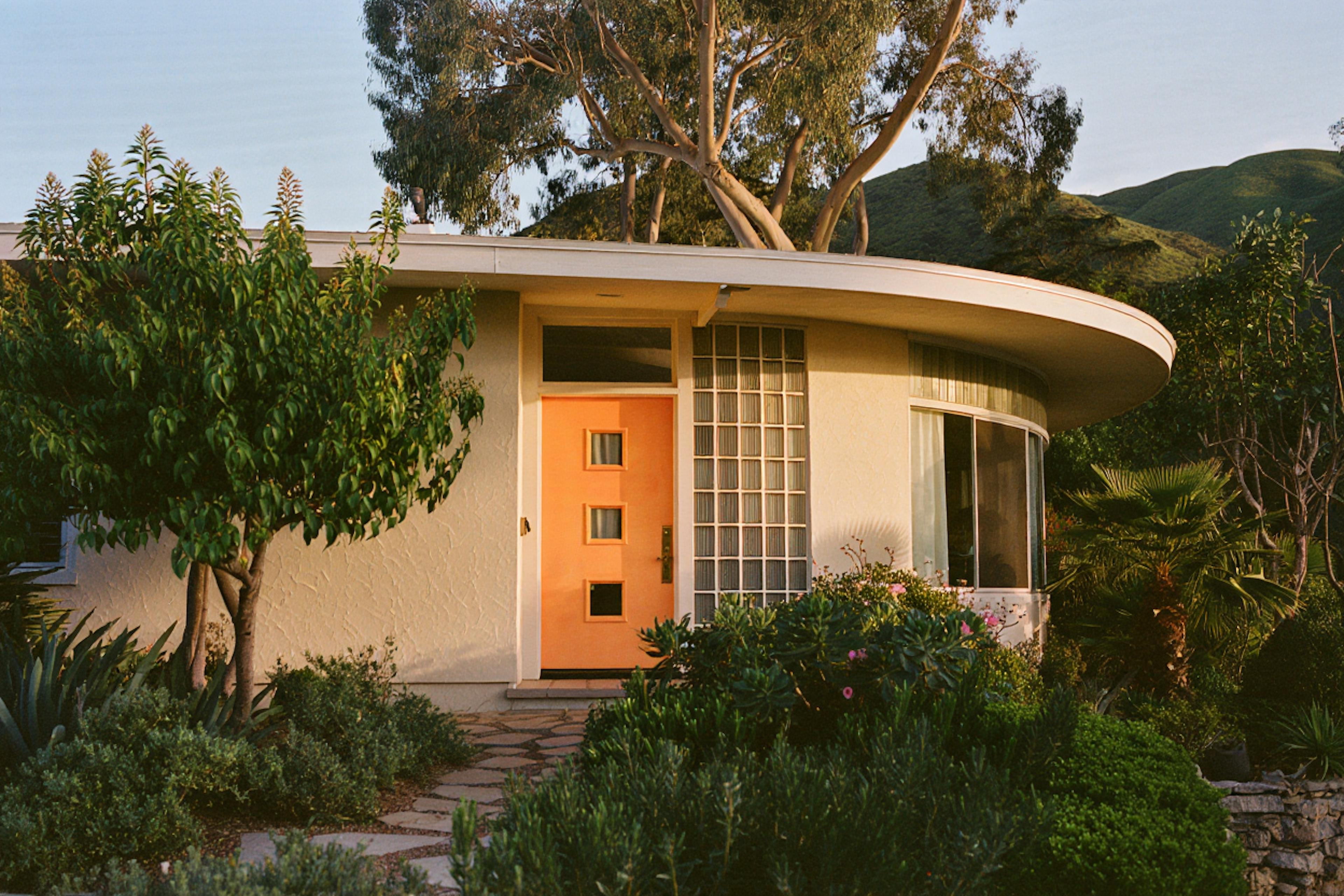 house with a orange flashy door sunset light