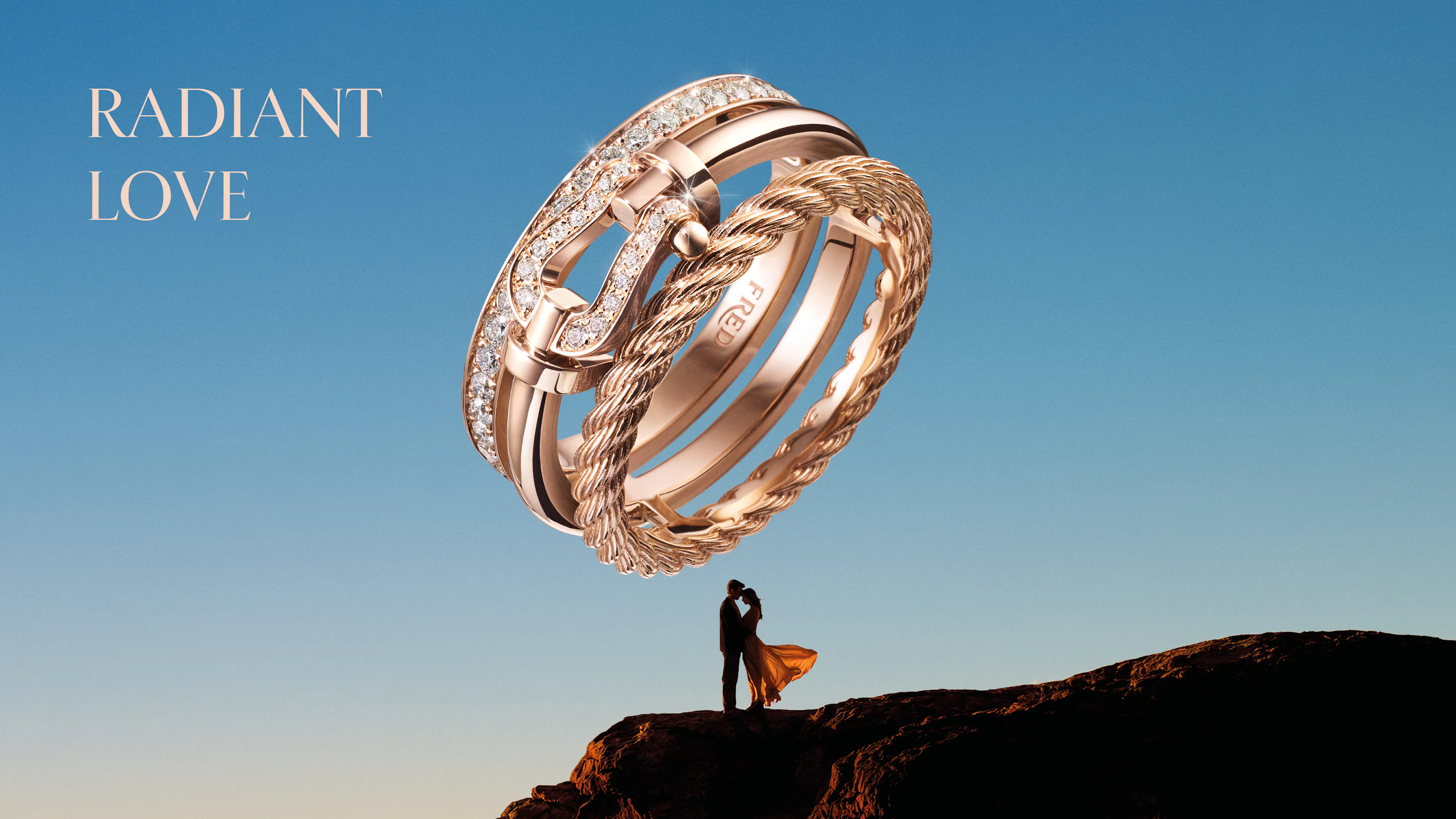 gold ring and a couple on a cliff