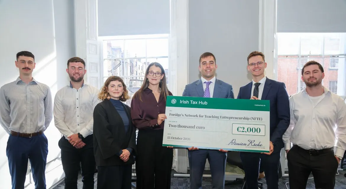Irish Tax Hub presenting a €2,000 cheque to the Foróige NFTE team at the office opening