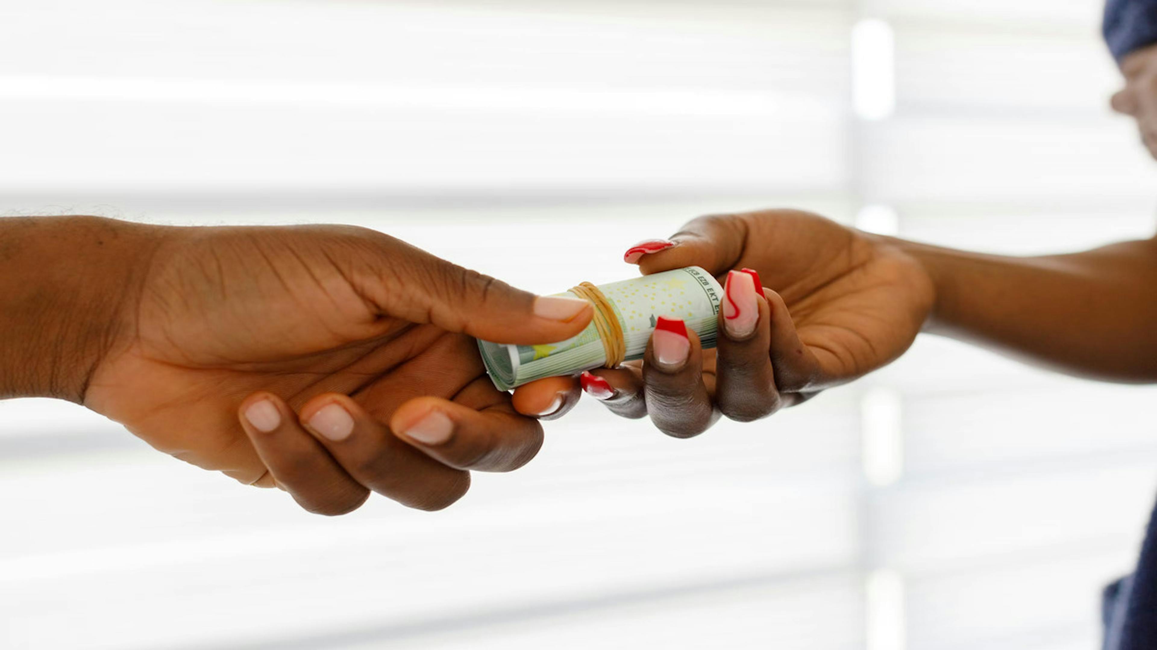 A picture of money exchanging hands