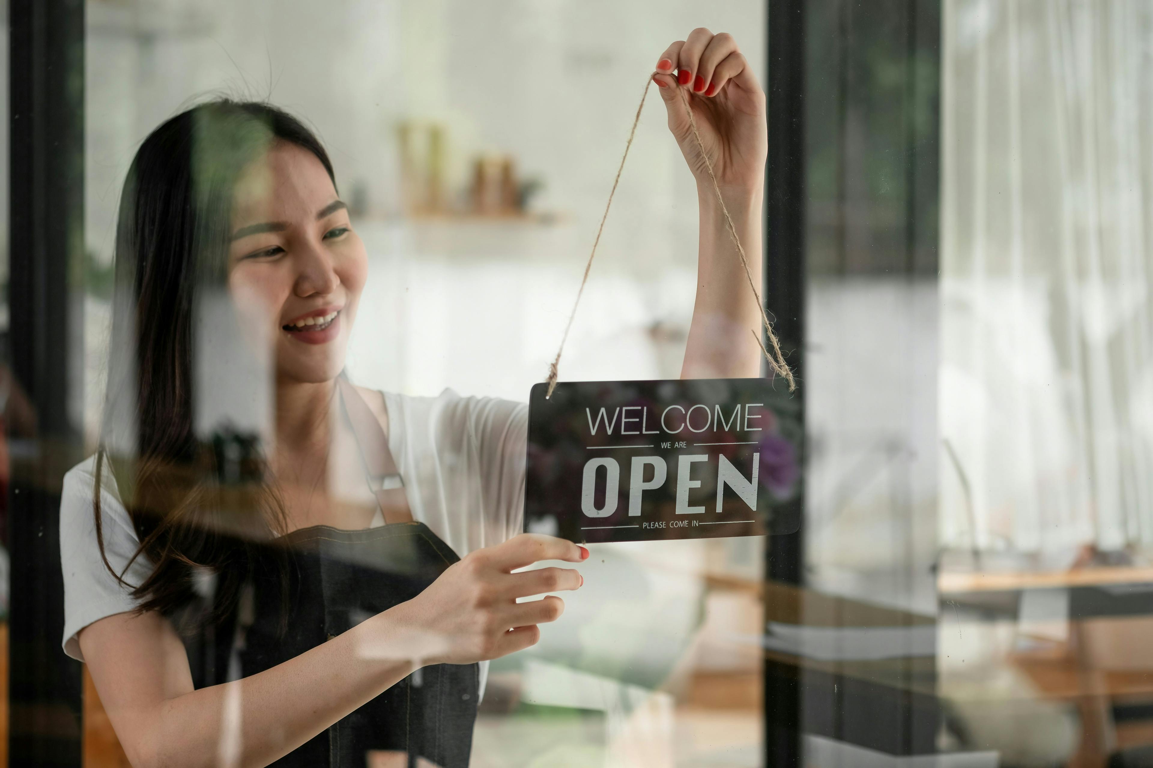 A woman opening a shop