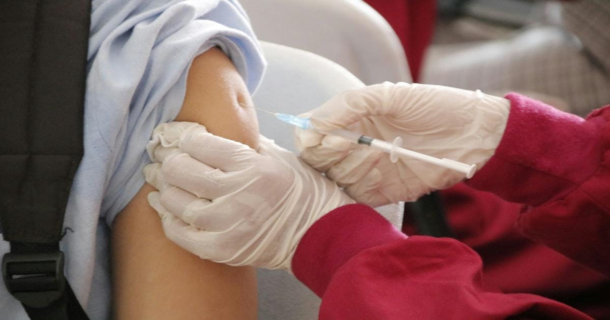Person taking a vaccine