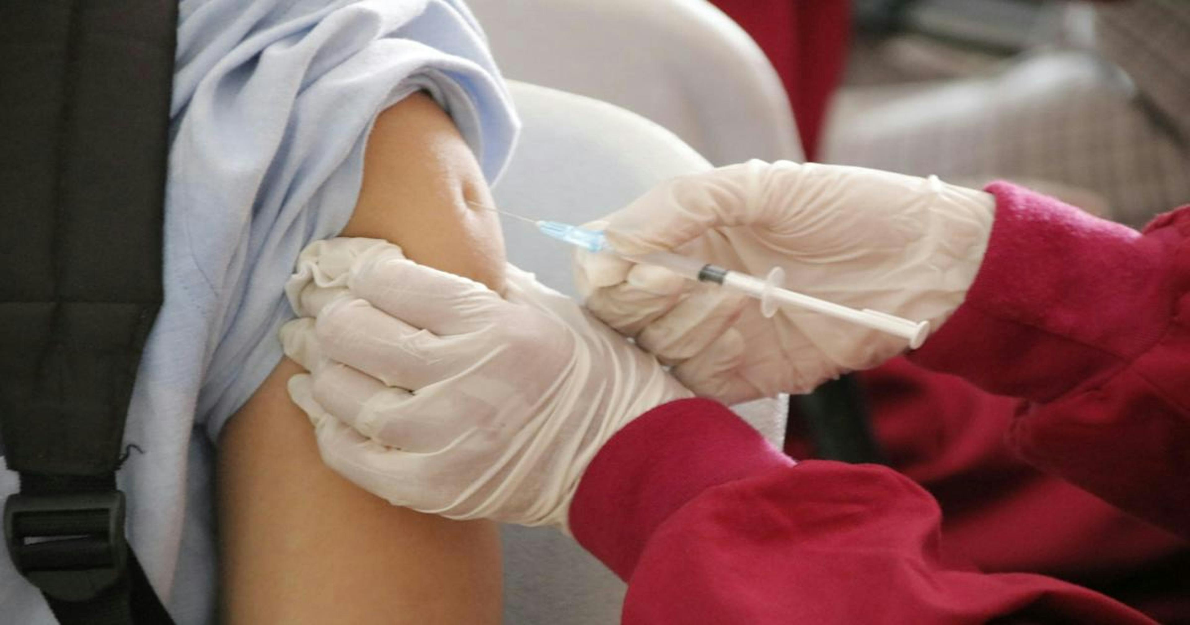Person taking a vaccine
