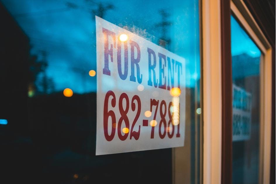 For rent sign in a window