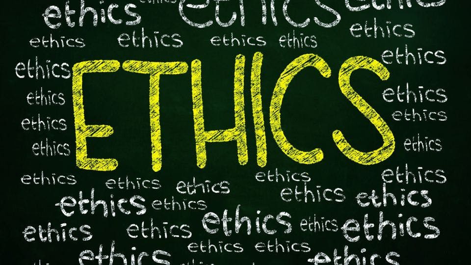 a chalkboard that says ethics