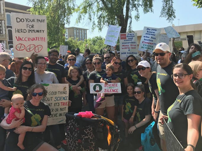 AJE employees at a March for Science rally in 2017