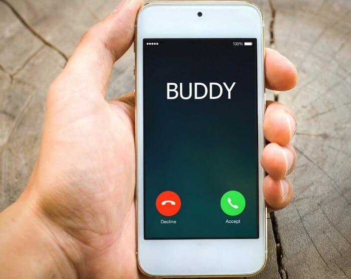 a cellphone with an incoming call from BUDDY