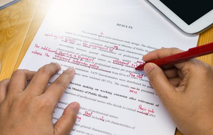 An academic editor fixing common english errors in academic writing