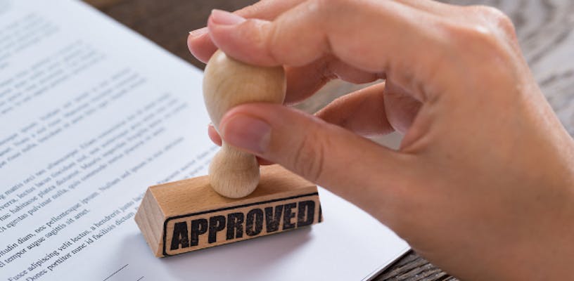 reviewer stamping Approved on a research grant proposal