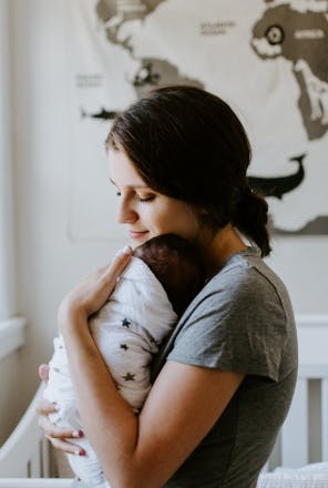 Mom hugging her baby
