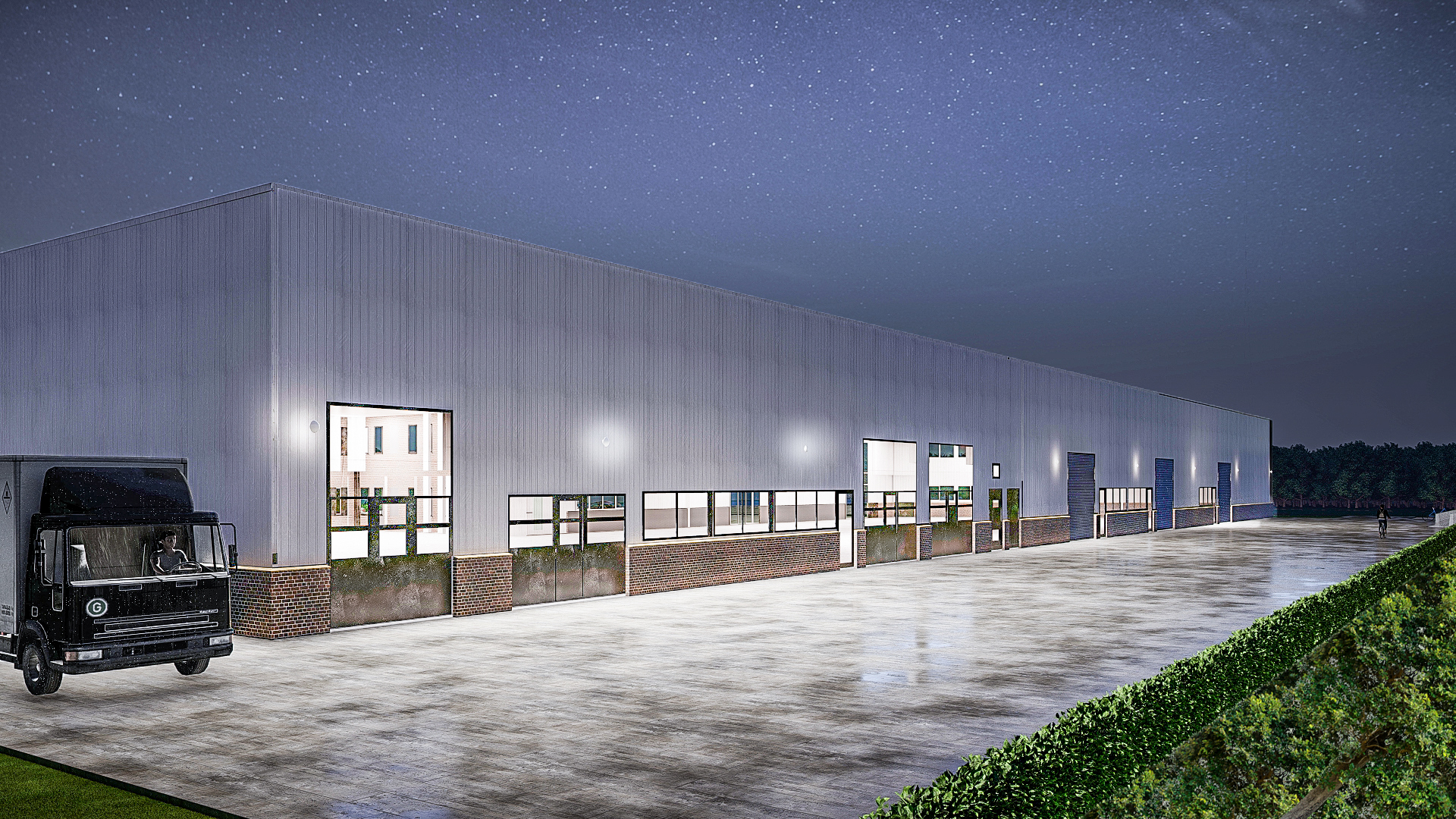 Die Vorderansicht der Logistikhalle - Neubau eines Bürogebäudes mit Ausstellungsbereich und Logistikhalle in Heinsberg.