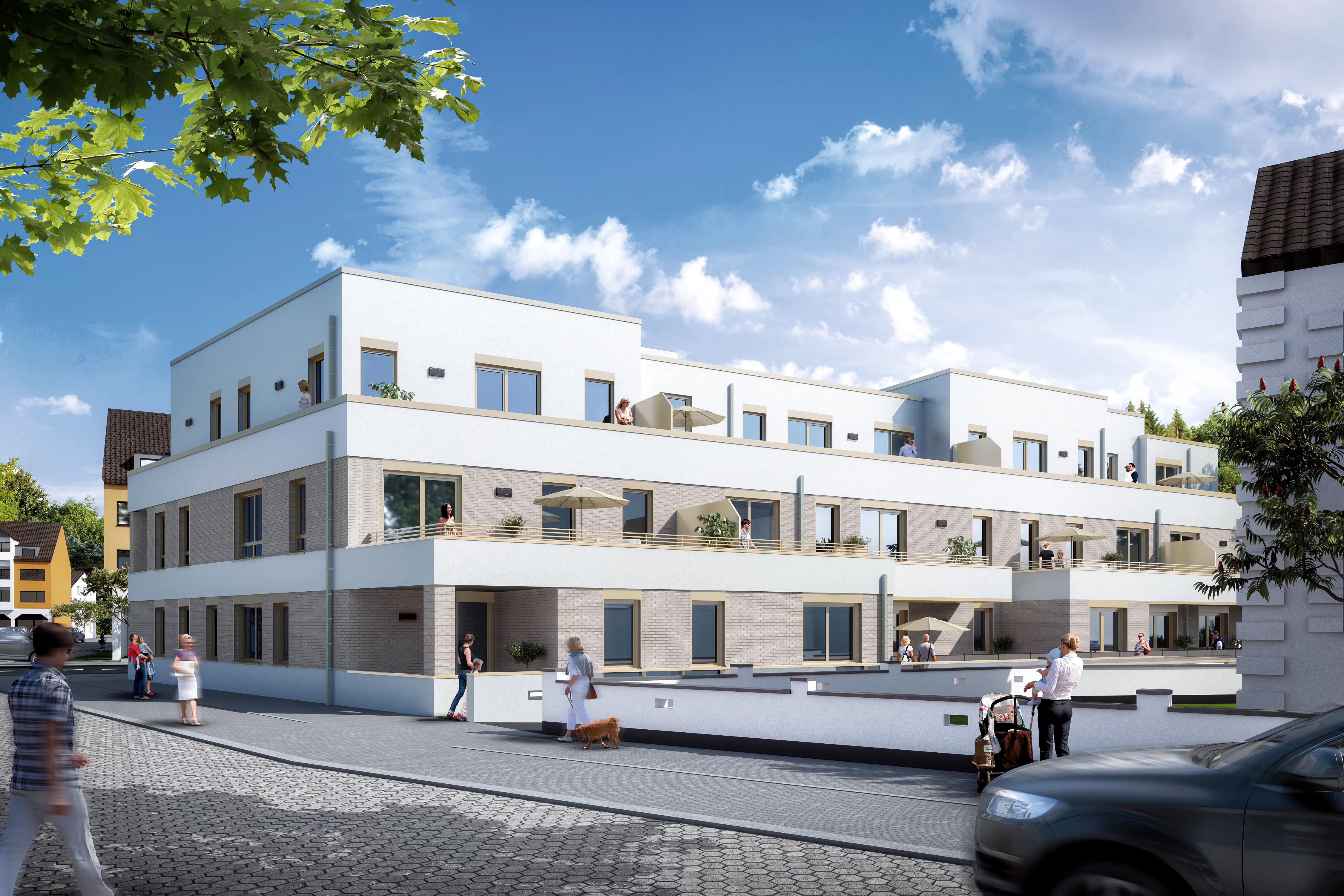 Die rückseitige Ansicht mit Staffelgeschoss und Terrassen bei Tag - Neubau eines Mehrfamilienhauses mit 22 Wohneinheiten und Tiefgarage in Troisdorf-Spich.