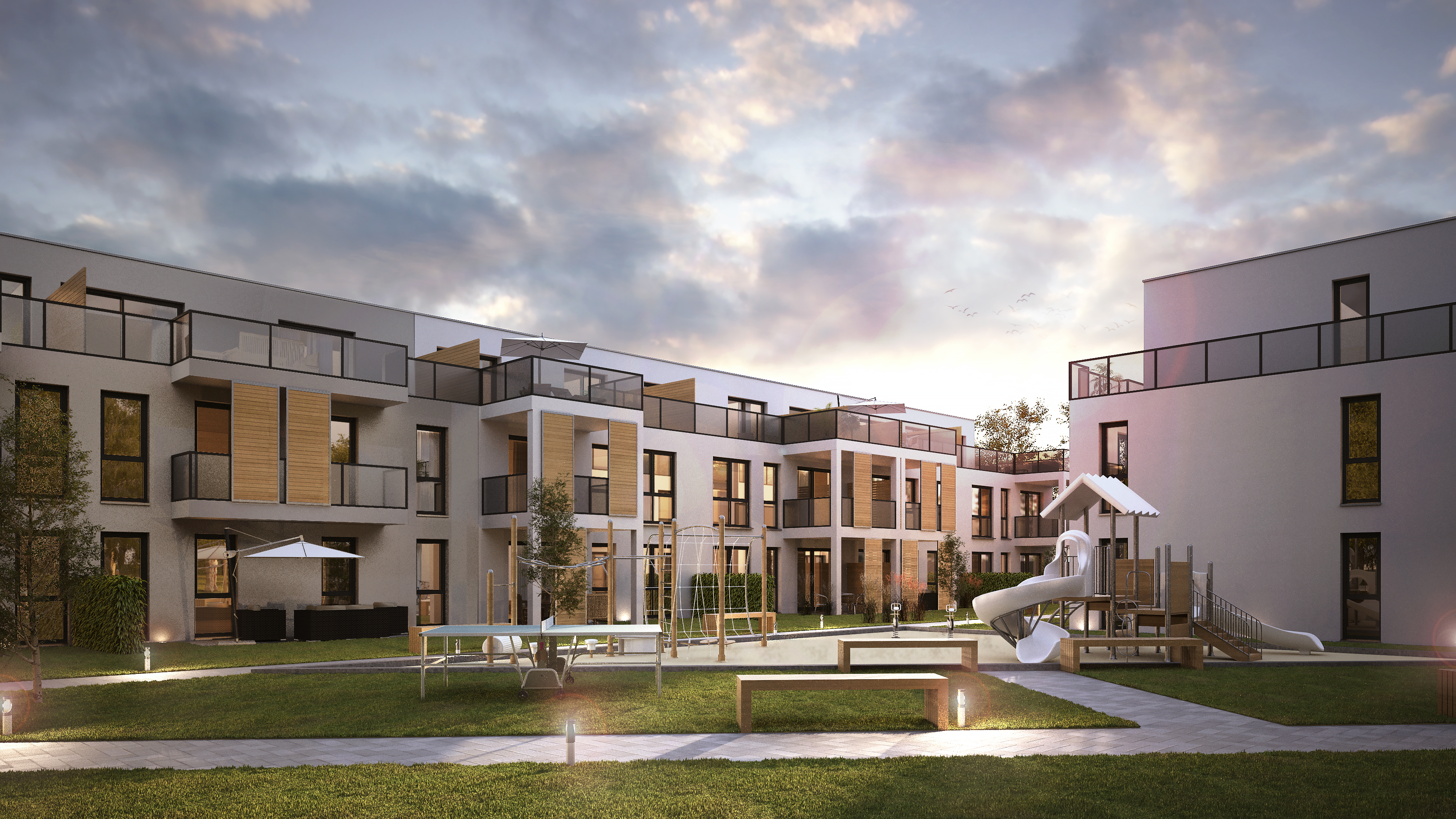 Der Innenhof mit Spielplatz - Mehrfamilienhaus und Boarding House mit Tiefgarage in Dormagen.