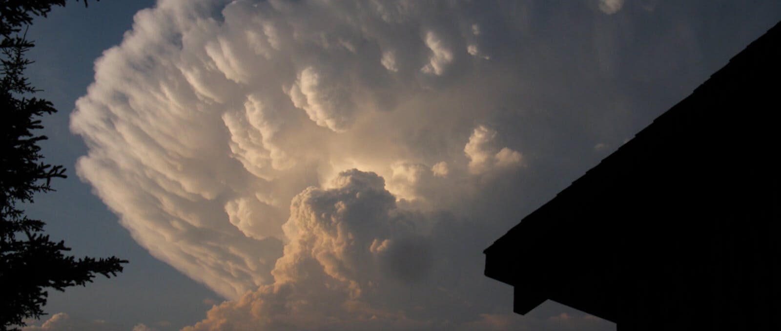 A thunderhead lit by evening light.