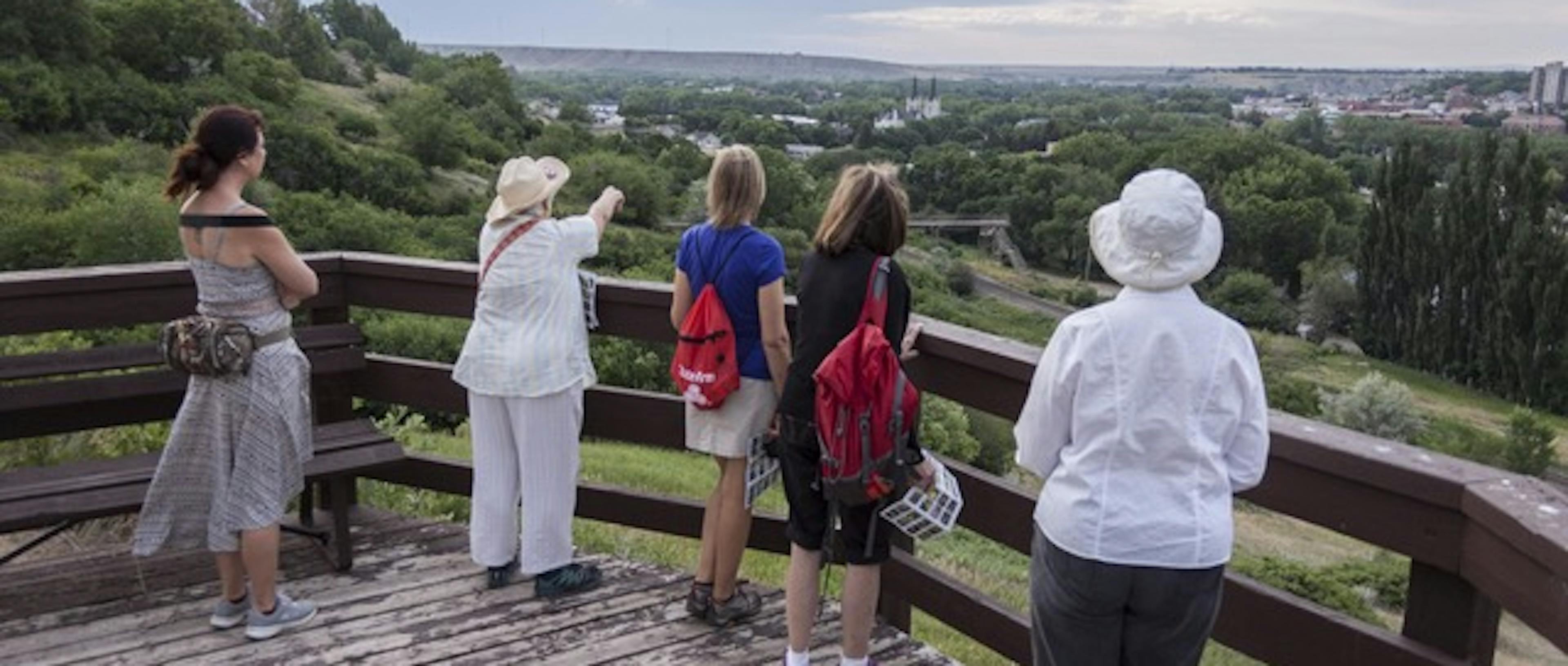 Photo of people looking onto Medicine Hat. Photo credit: Len Moser. 