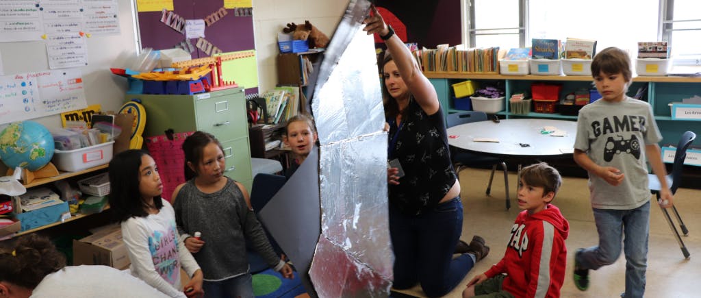 Children playing with a shiny object