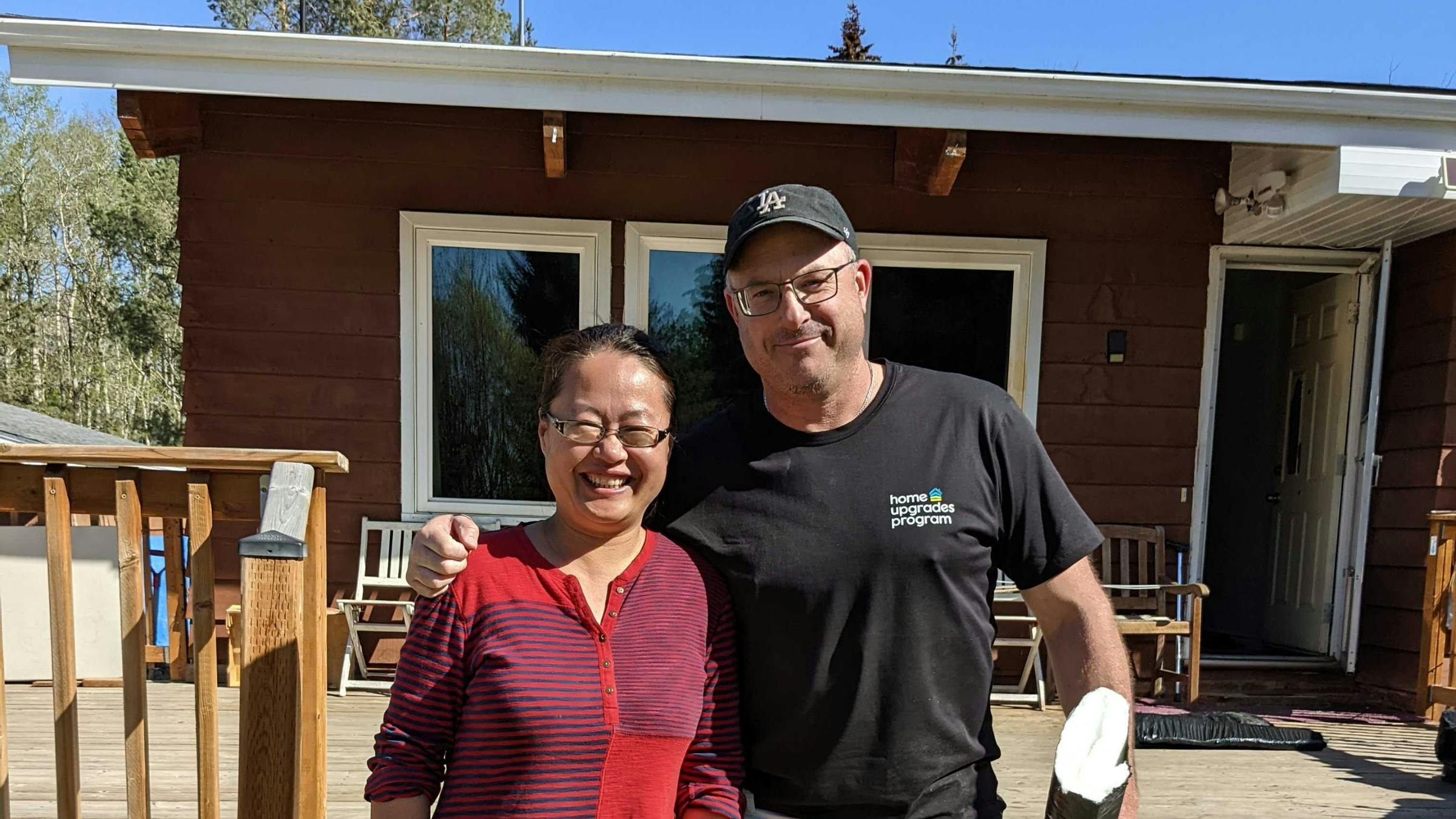 Mr. and Mrs. Zheng's daughter, Nancy, with Tim Harris, Construction Manager and Energy Assessor with the Home Upgrades Program