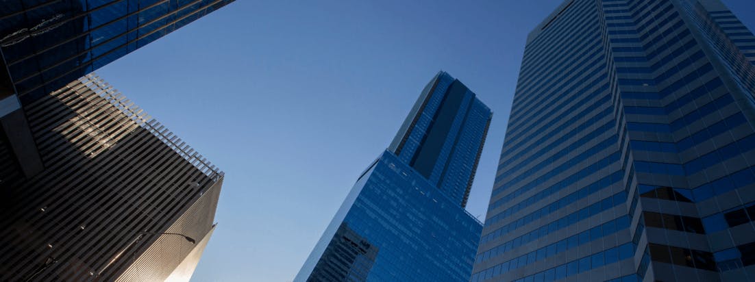 Tall skyscrapers against a blue sky.