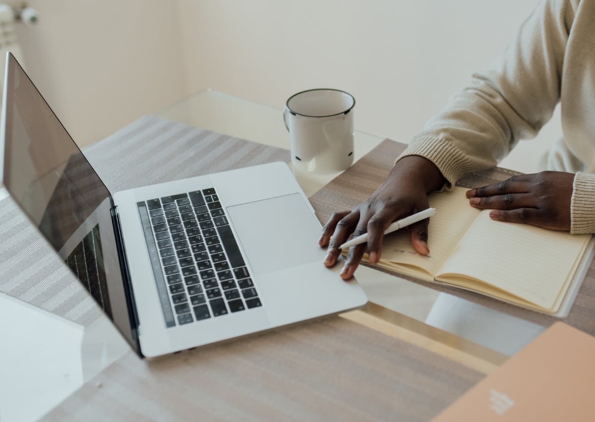 Close up up person's working from home supplies
