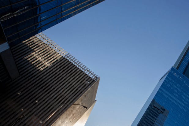 Tall skyscrapers against a blue sky.